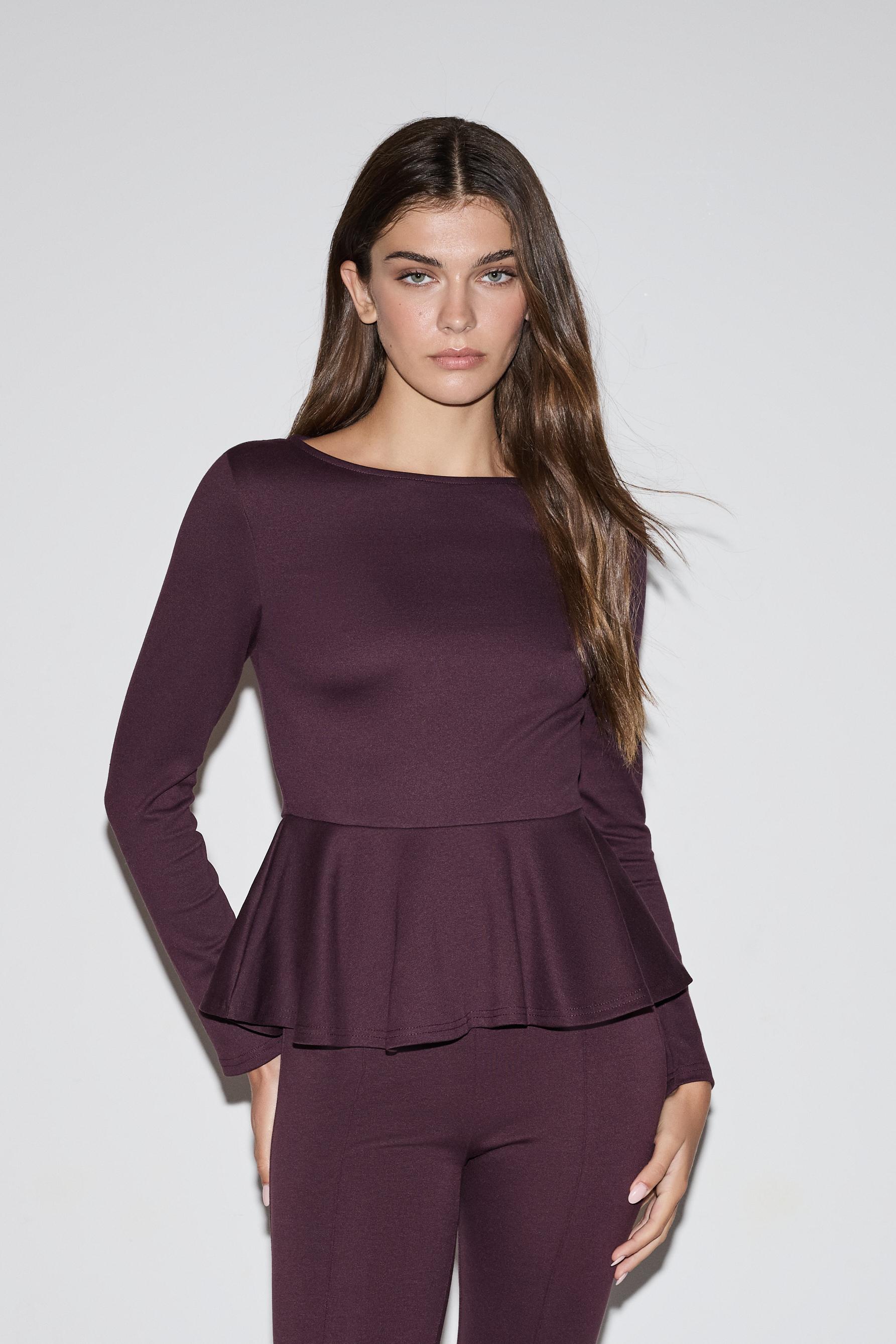 Top peplum manga larga