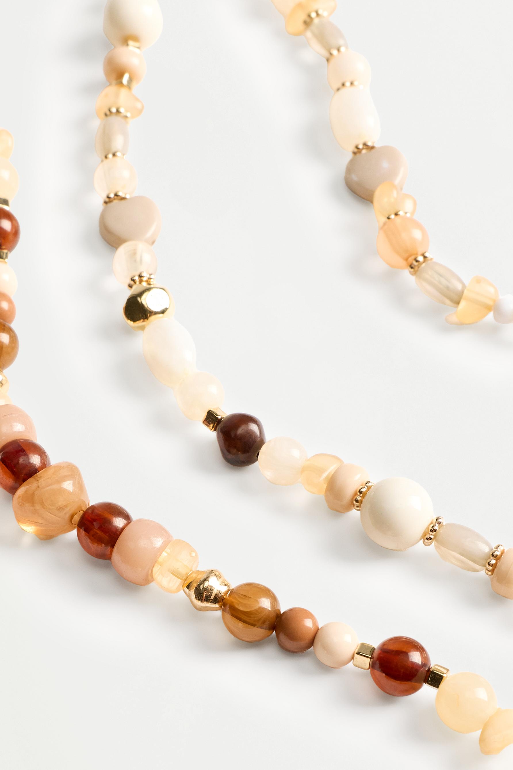 Double-strand long beaded necklace — VARIOUS
