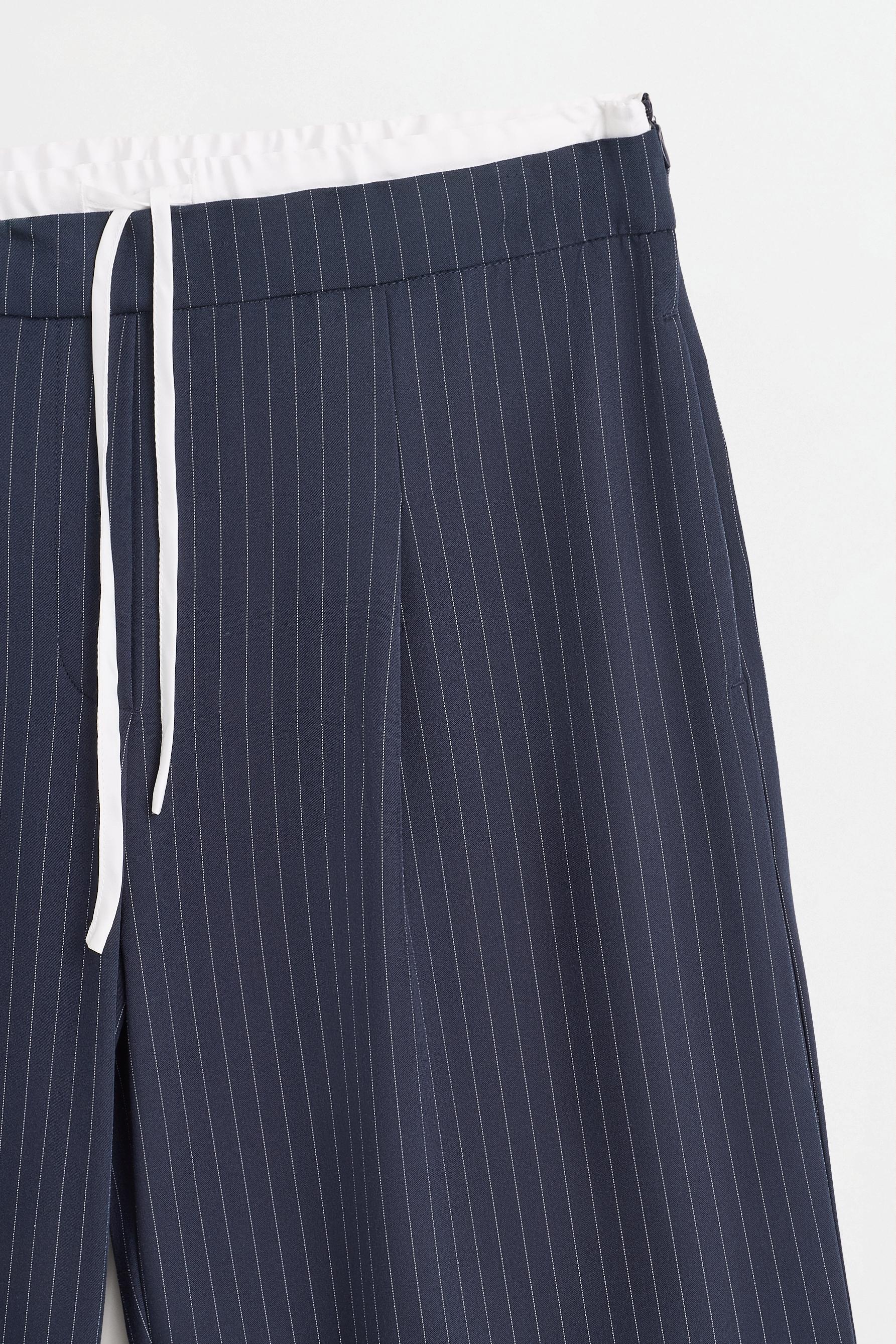 Striped contrast waistband trousers — NAVY