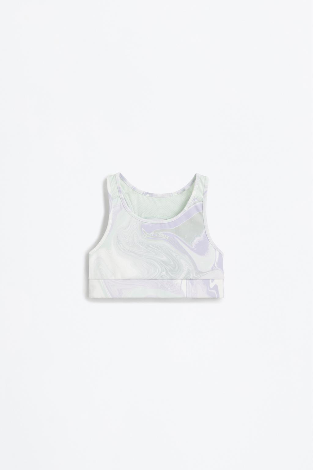Sports top with rubberised slogan