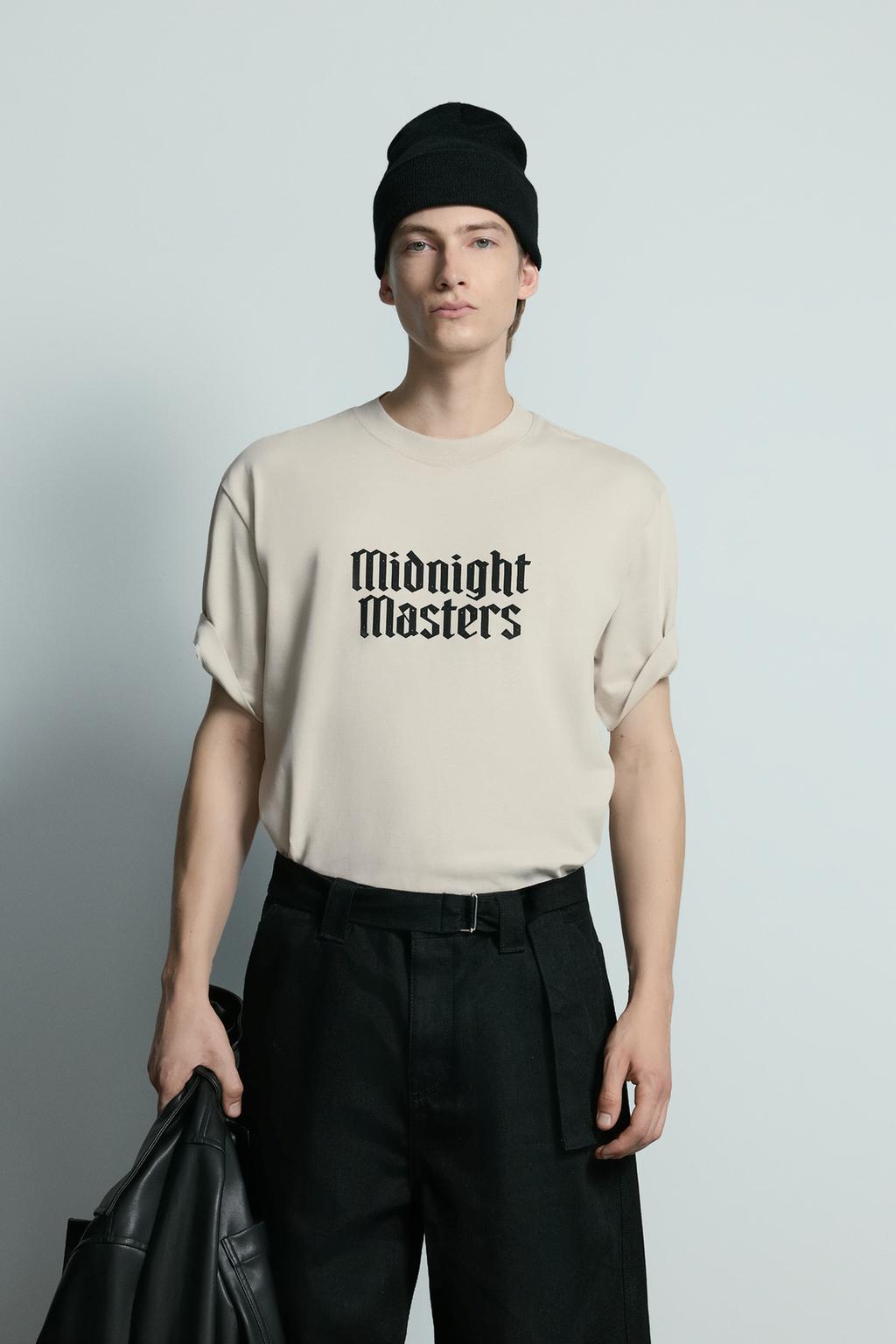 Kamiseta brodatua eta metalezko botoiak