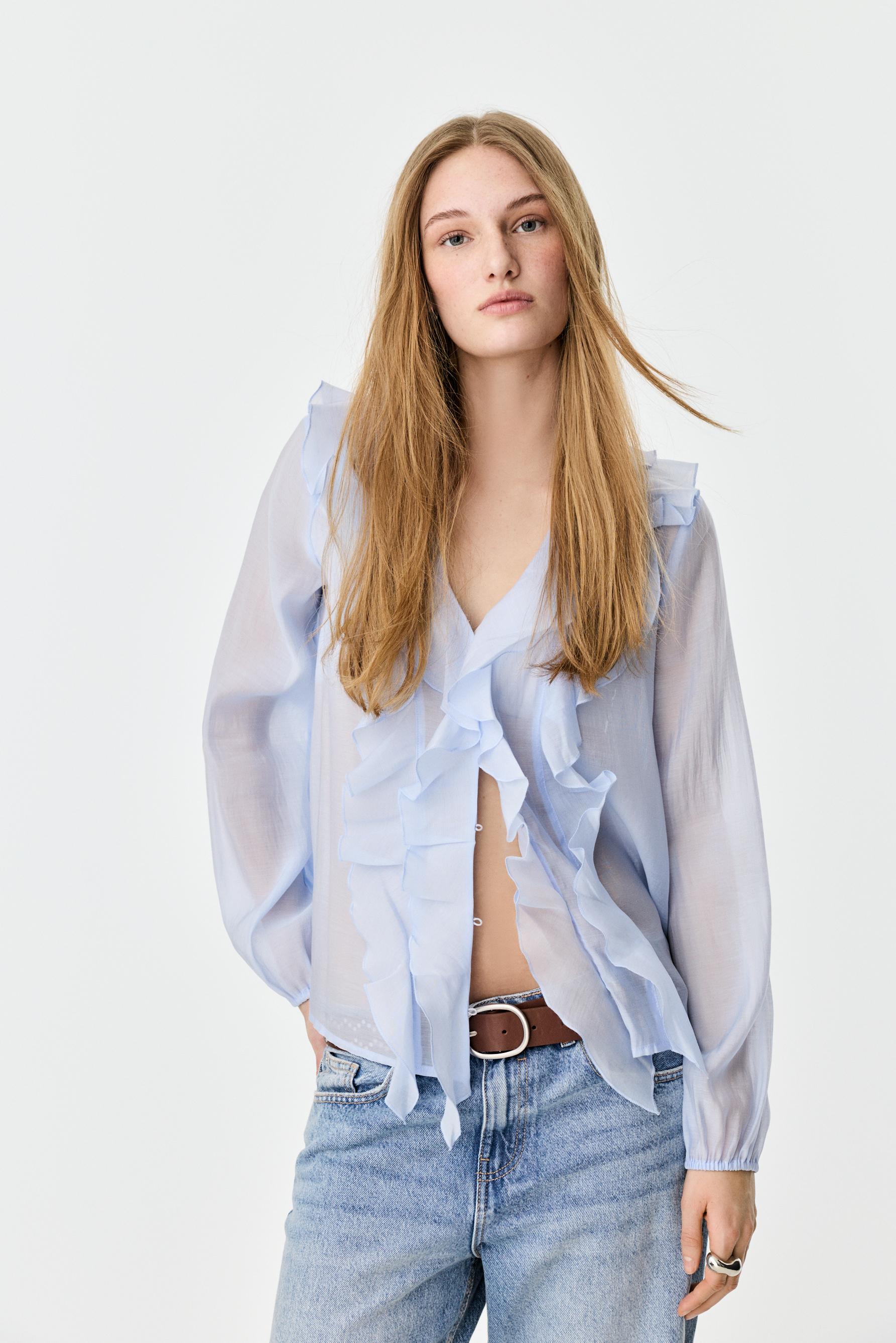 Camisa volantes semitransparente