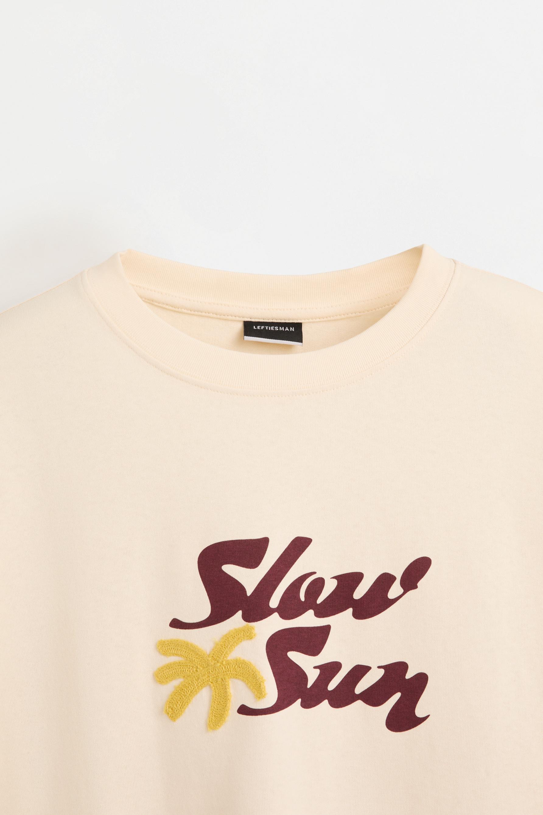 Embroidered text T-shirt — BUTTER