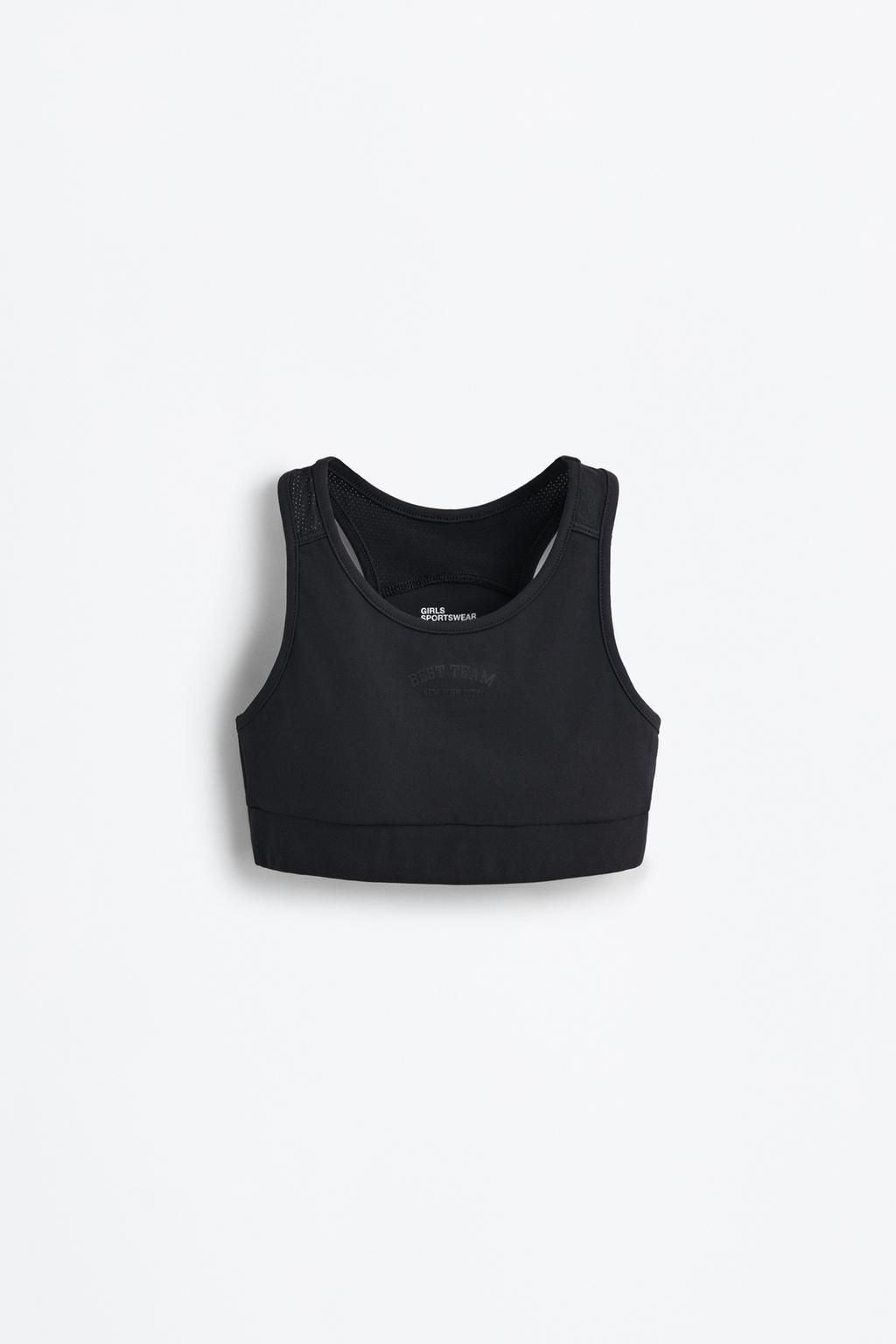 Sports top with rubberised slogan
