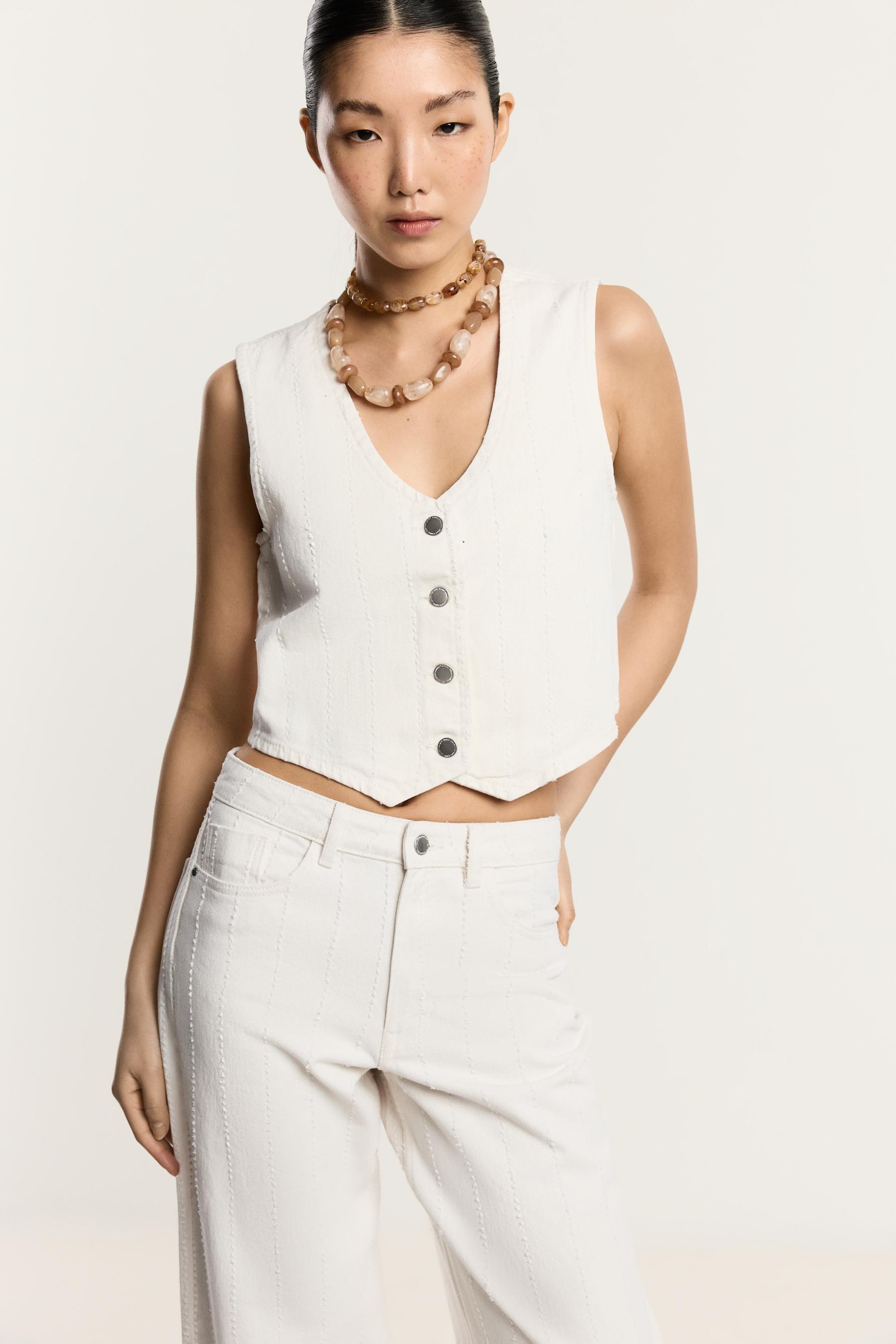 Chaleco denim pespuntes