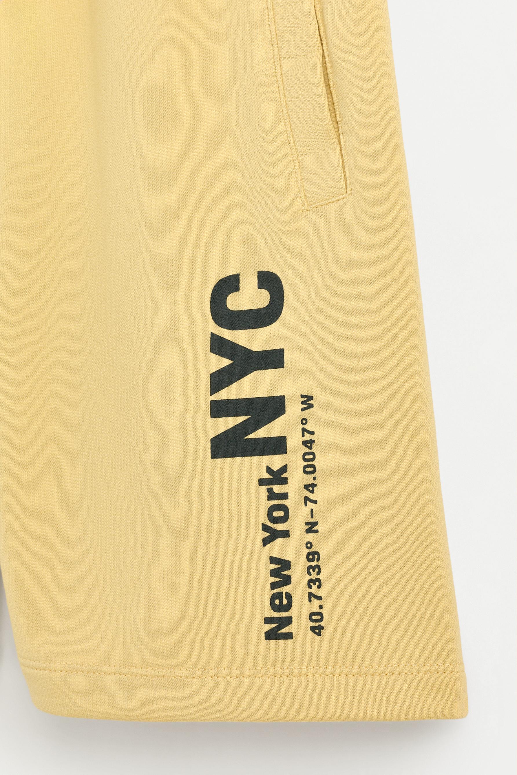 Text print plush Bermuda shorts — MUSTARD