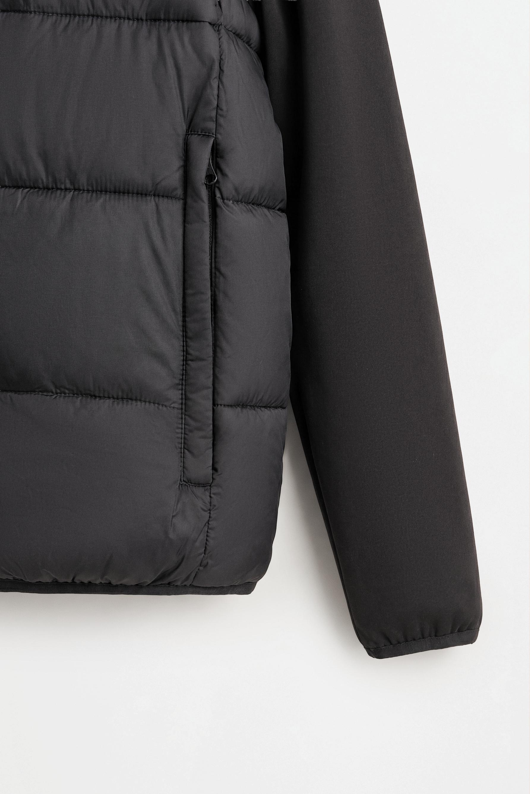 Quilted jacket with interlock sleeves — BLACK