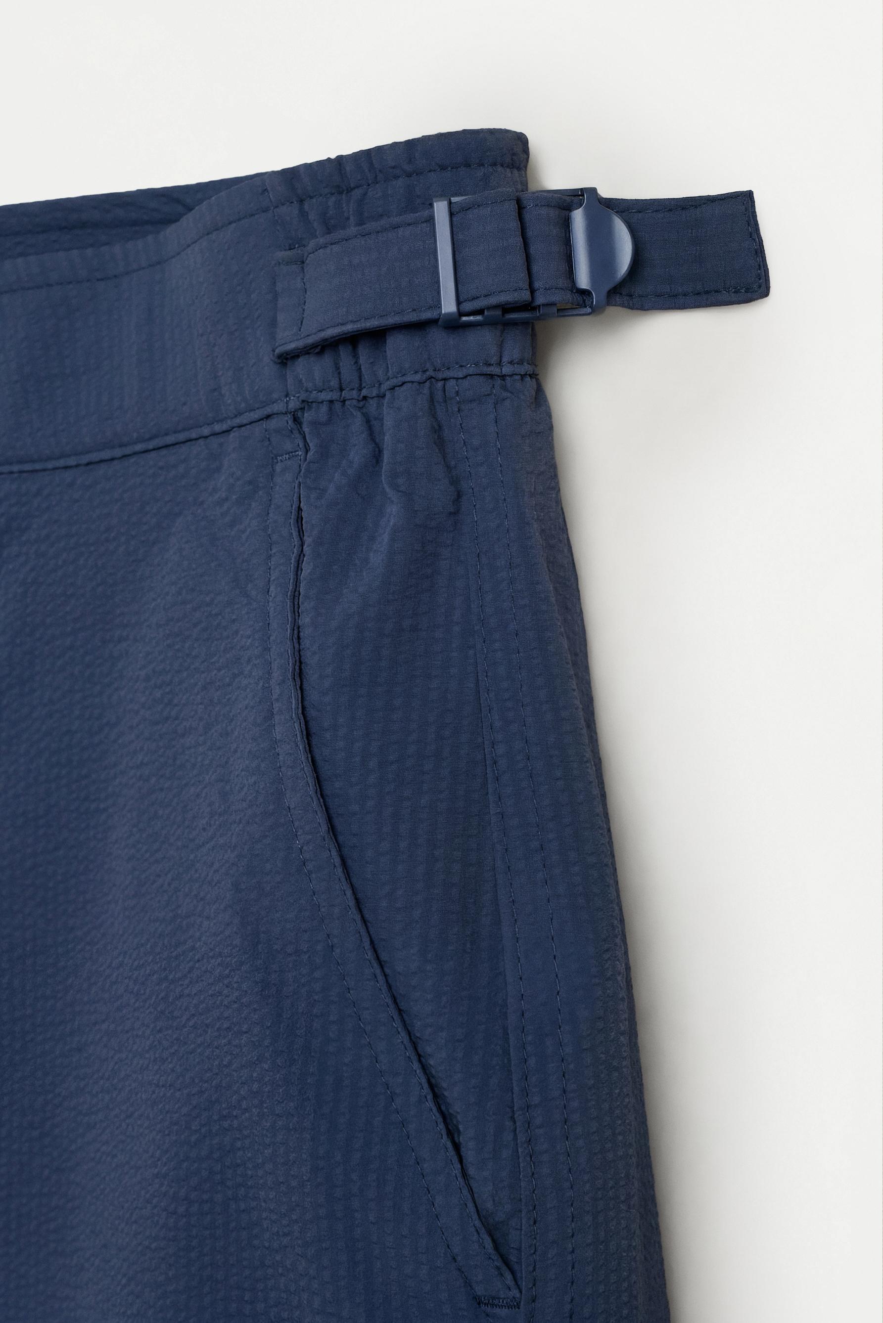 Short swim trunks with buckles — NAVY