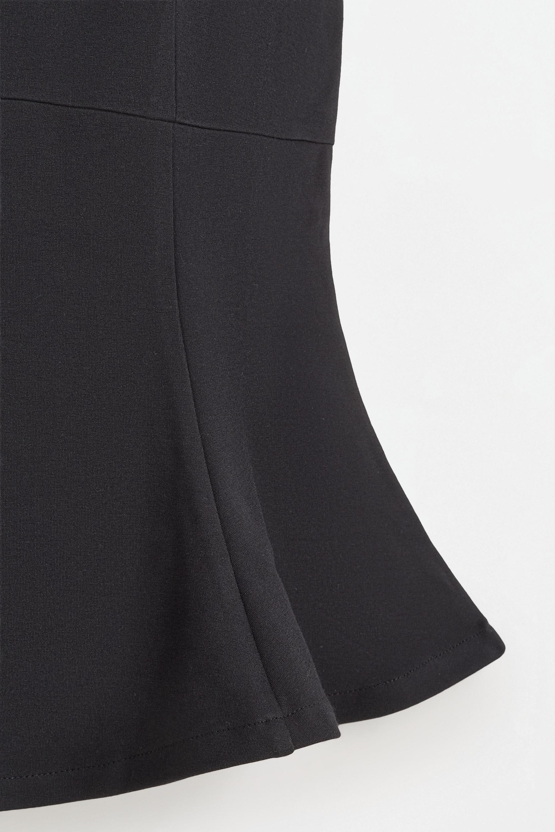 Interlock peplum top — BLACK