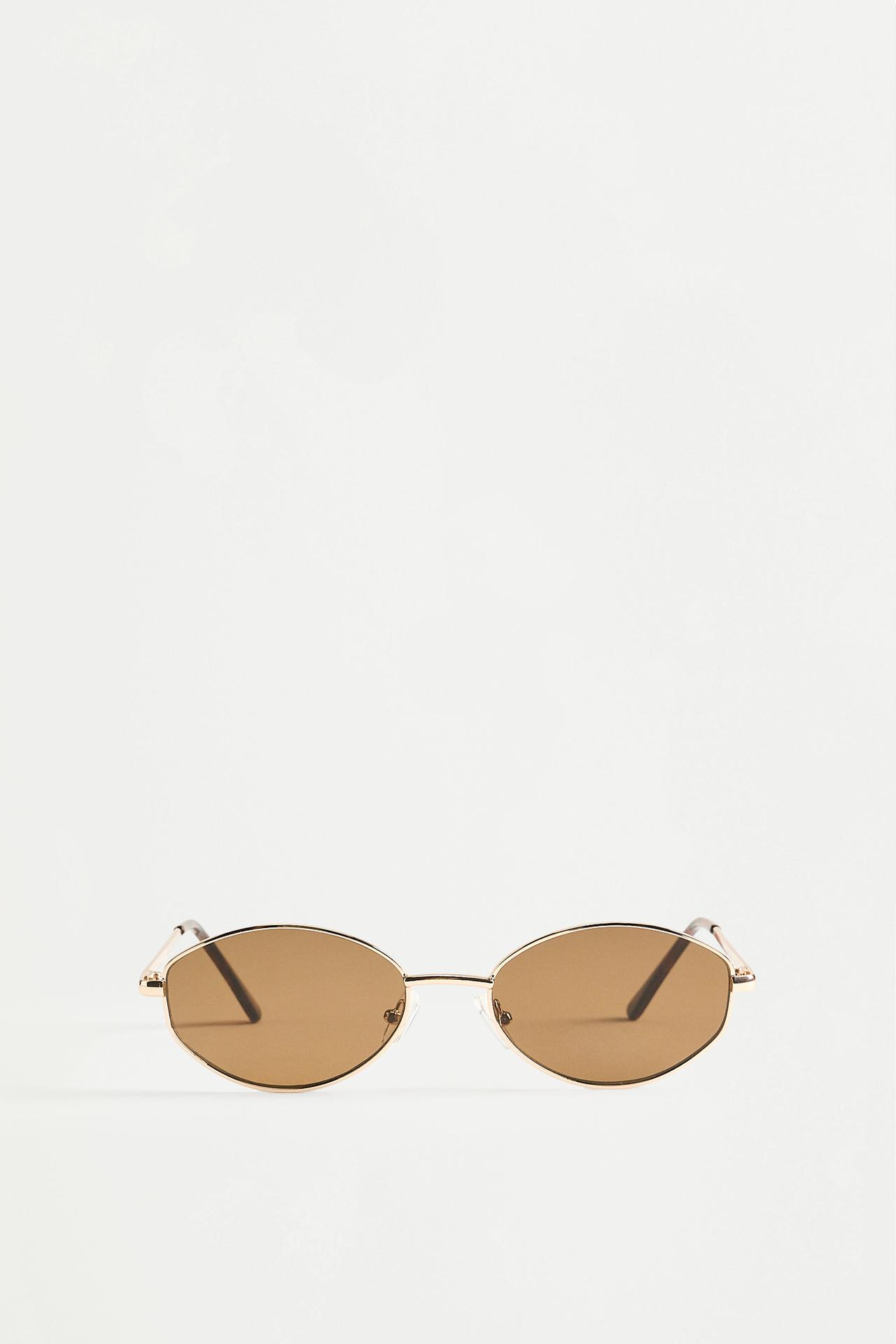 Irregular oval metallic sunglasses — GOLD