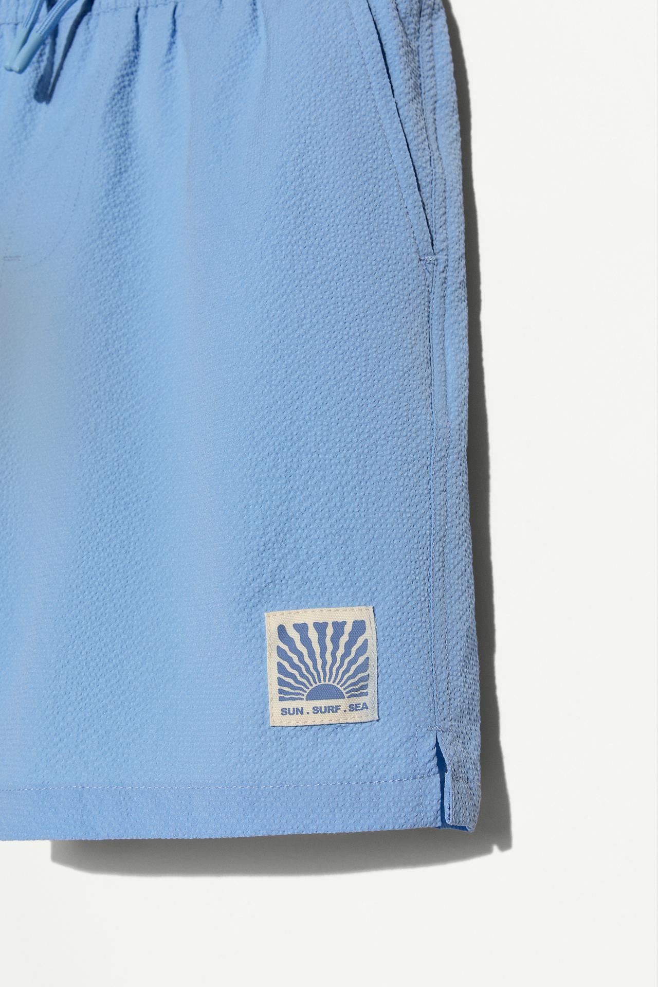 Seersucker Swim Trunks — PALE BLUE