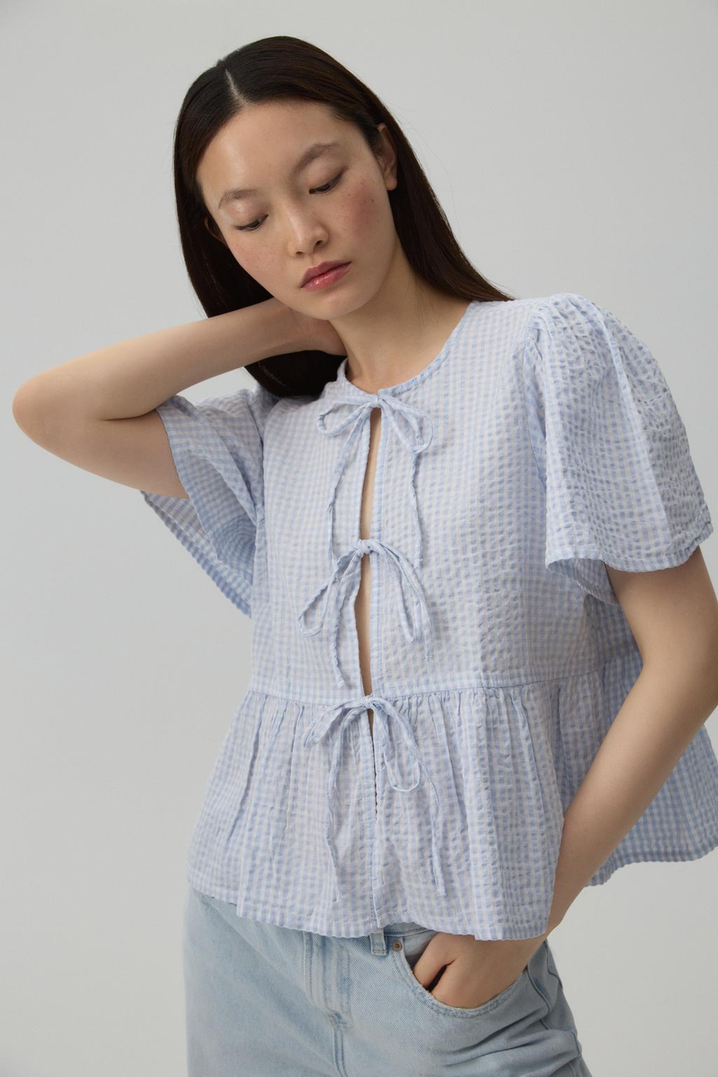 Camisa llaçades