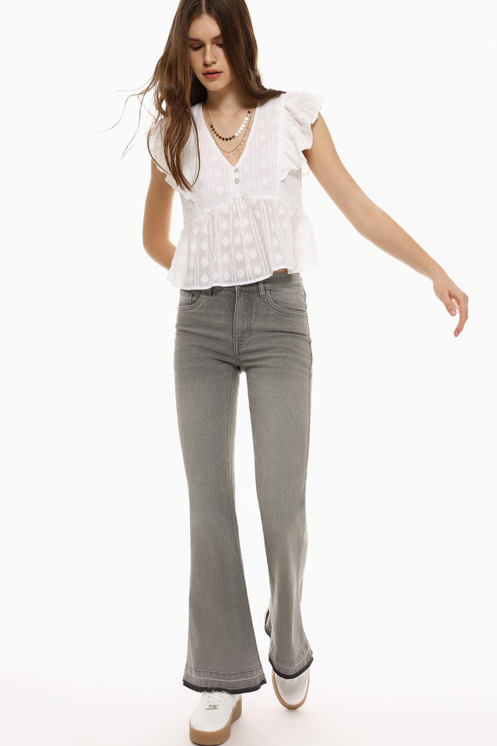 Flared jeans with frayed hems