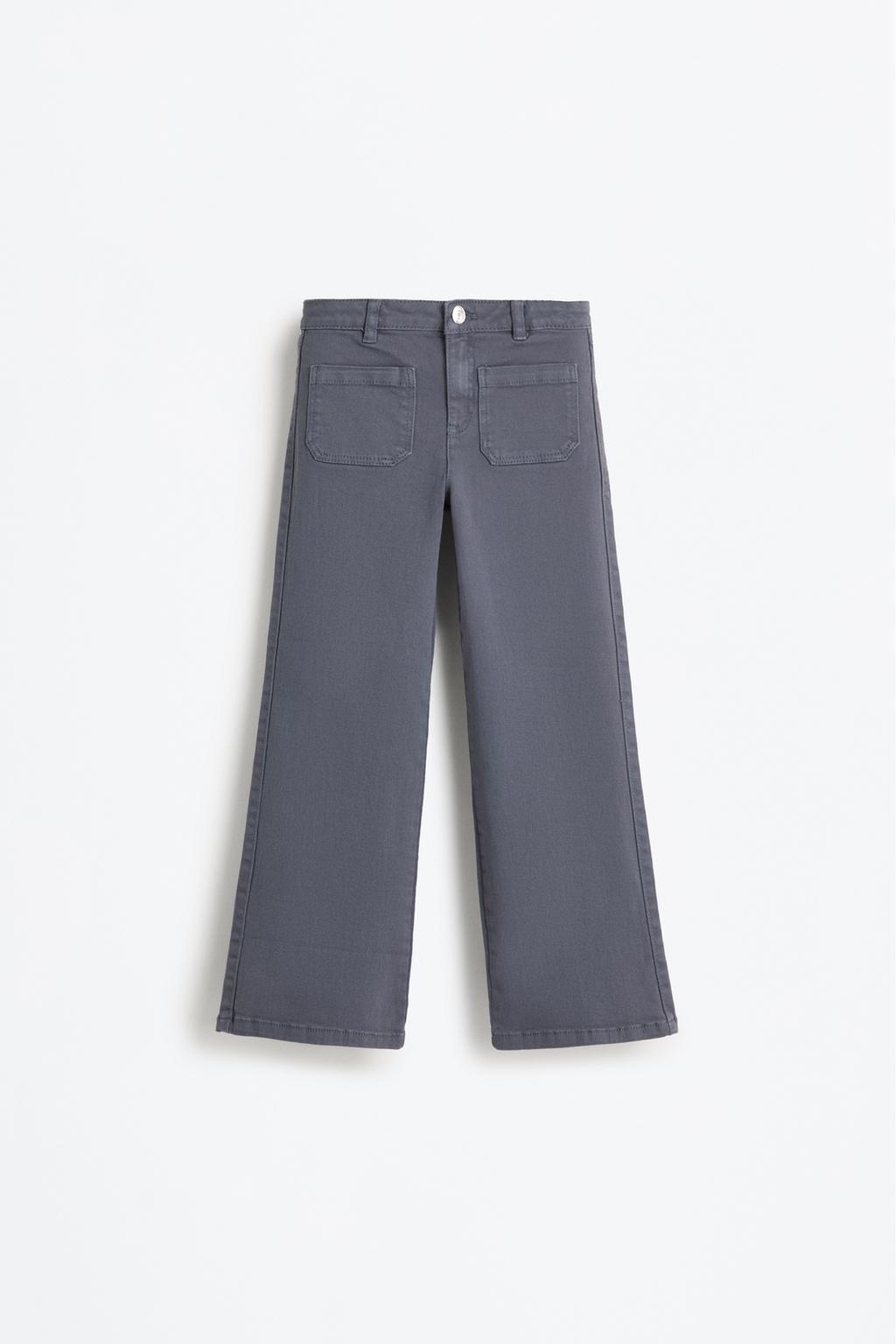 Calças boca de sino bolsos