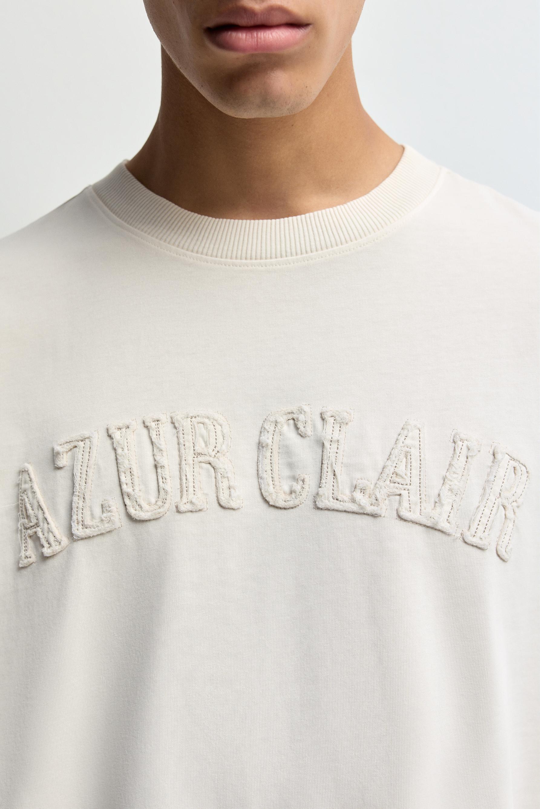 Slogan patch T-shirt — BUTTER