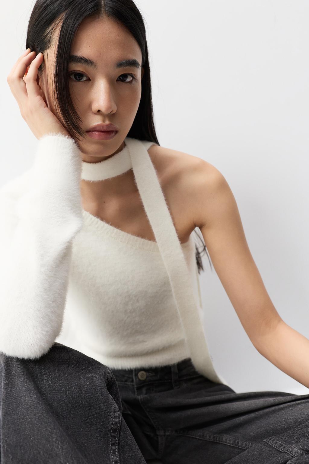 Asymmetric faux fur sweater