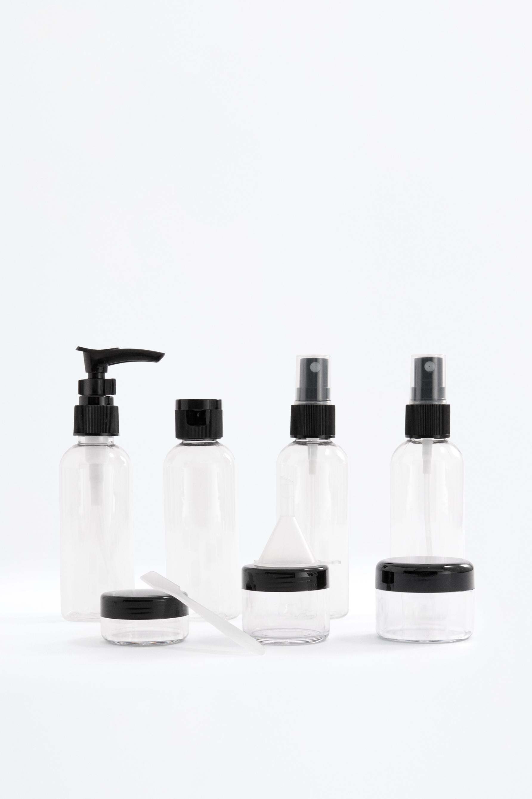 7-piece reusable travel bottle set — BLACK