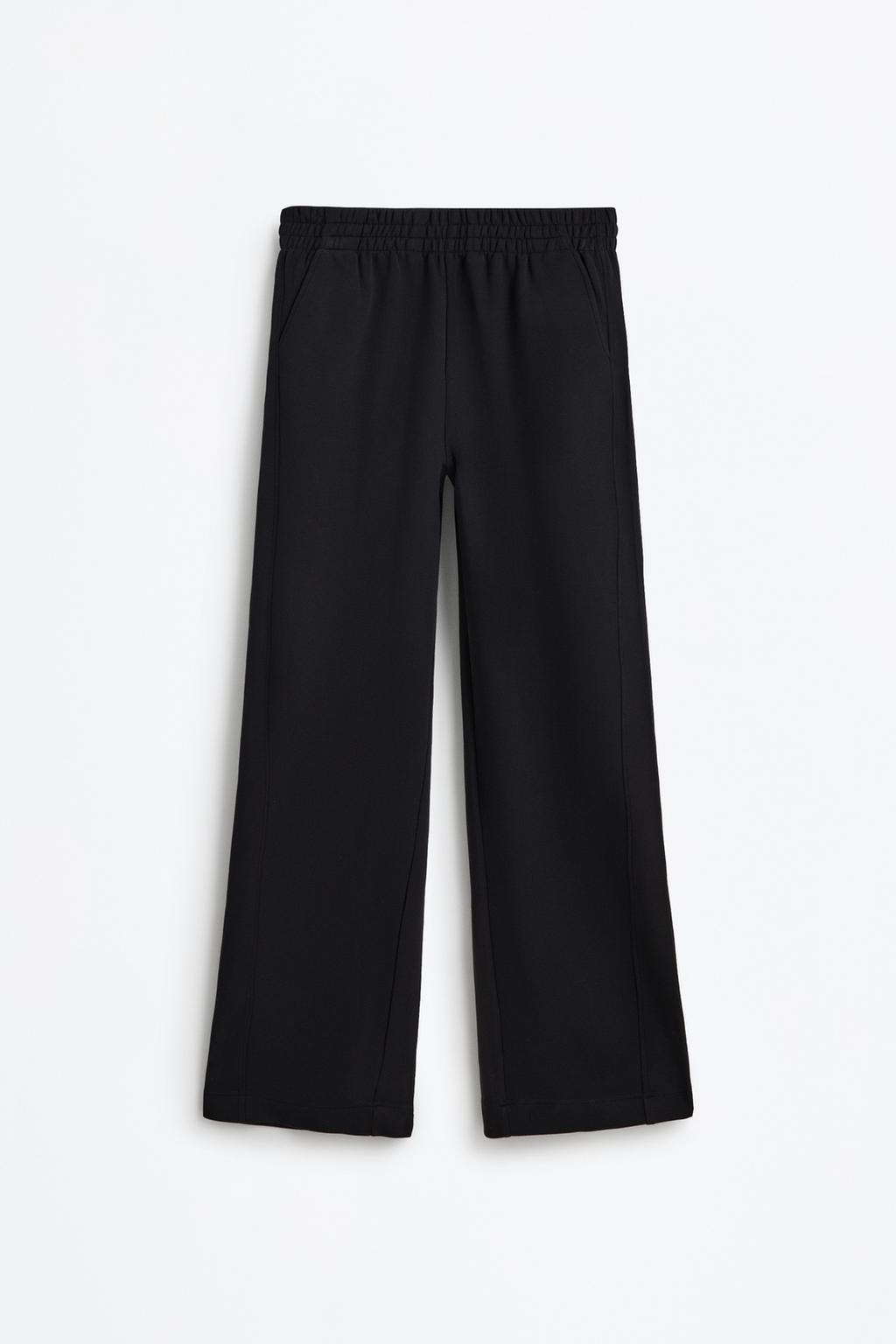 Flowing sports trousers with seams