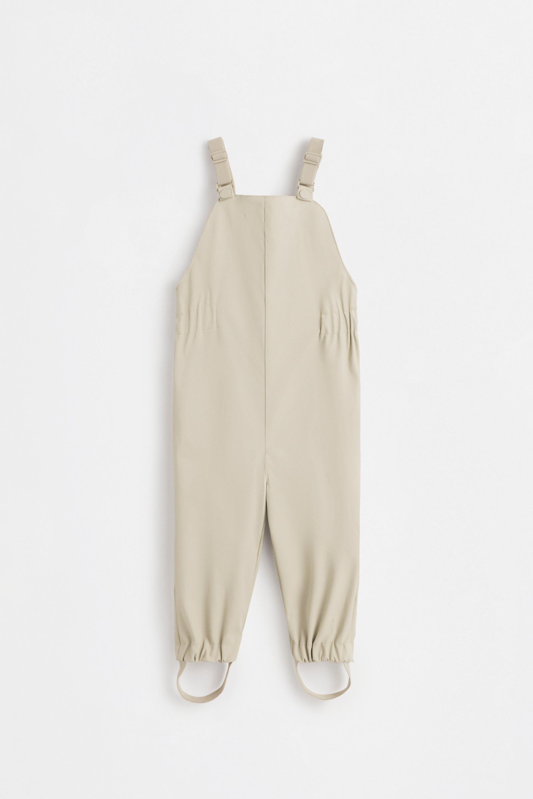 Rubberised fleece-lined dungarees — BEIGE