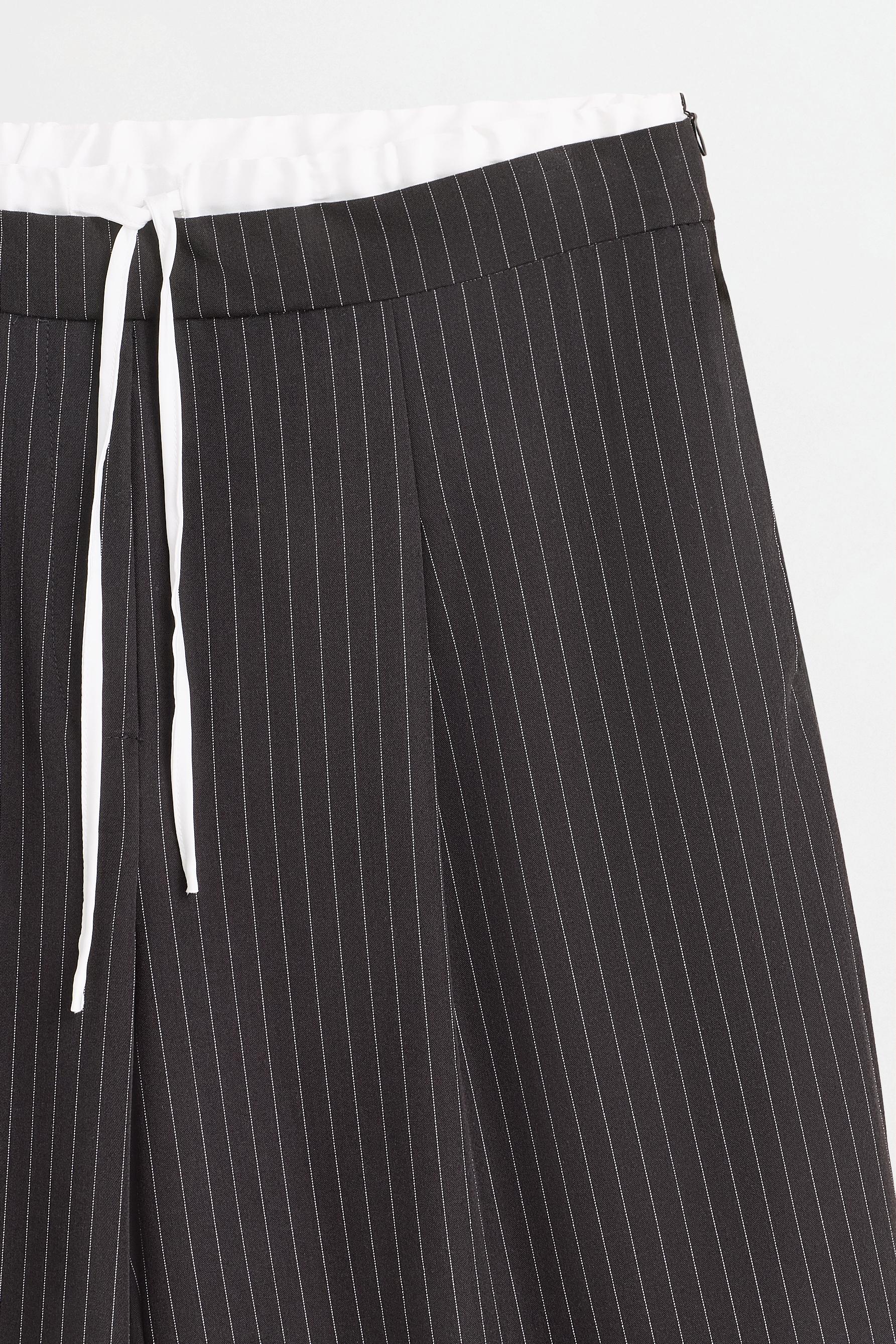 Striped contrast waistband trousers — BLACK