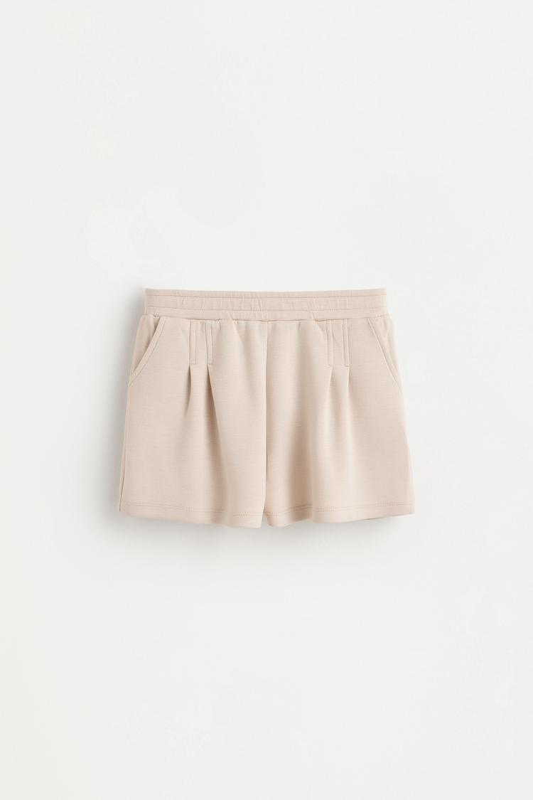 Flowing plush pleated shorts — BEIGE