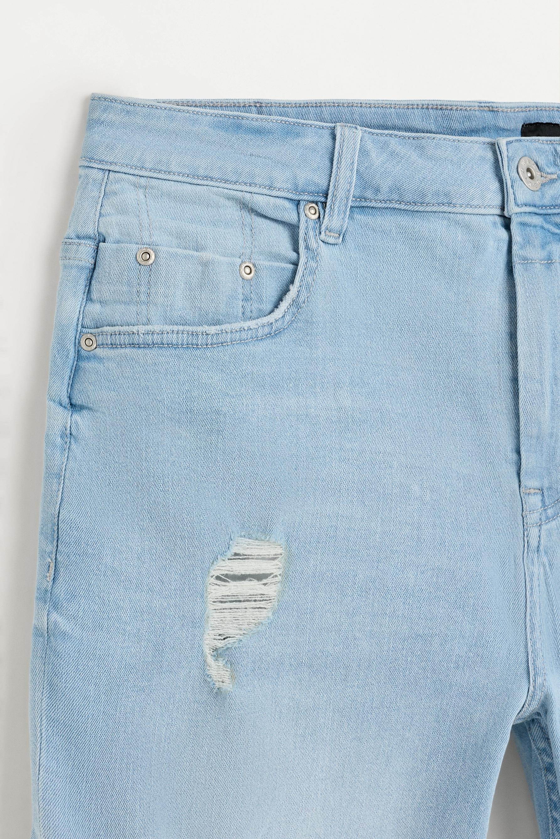Distressed skinny denim Bermuda shorts — PALE BLUE