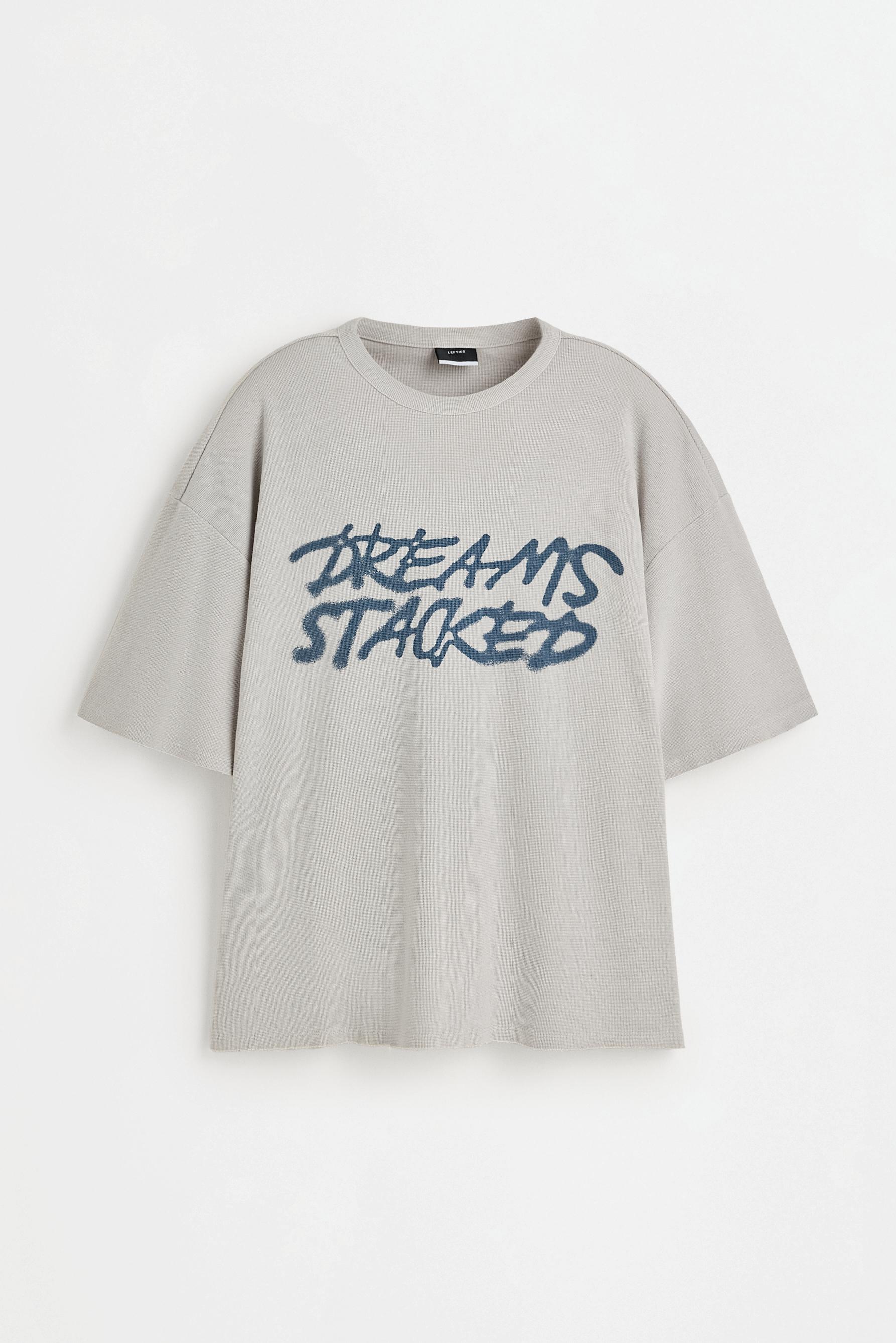 Faded-effect slogan T-shirt — STEEL