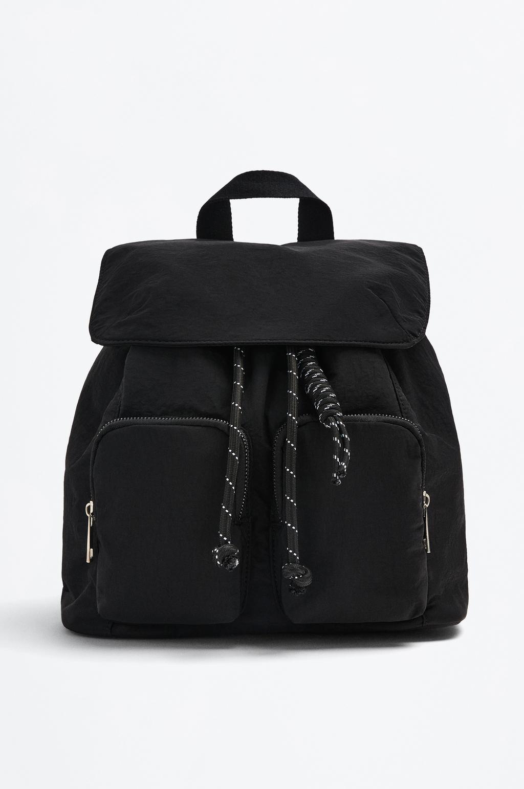 Trench backpack with charm