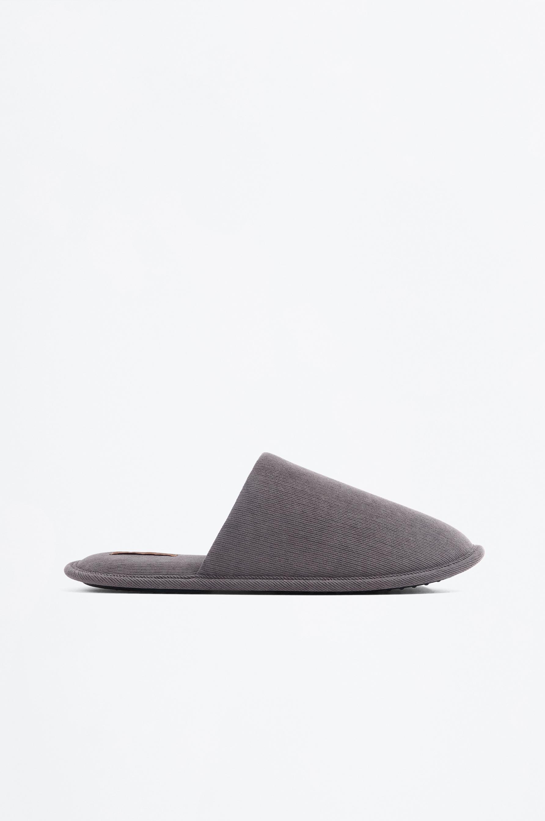 Zapatilla de casa tejido