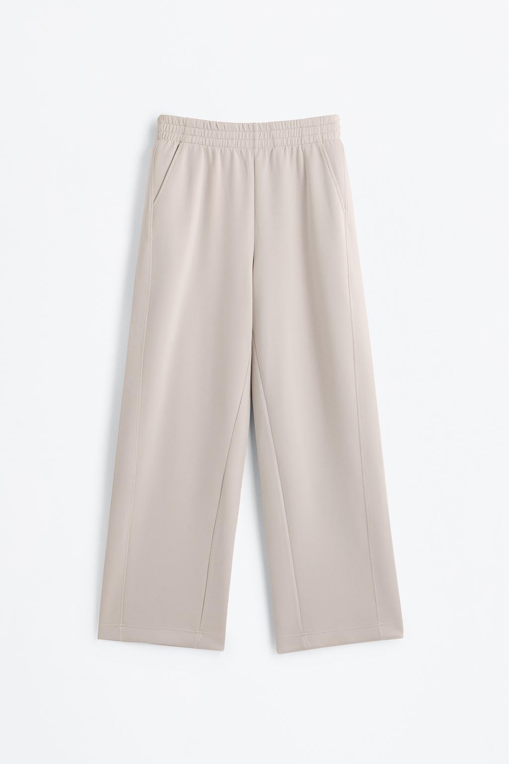 Flowing sports trousers with seams