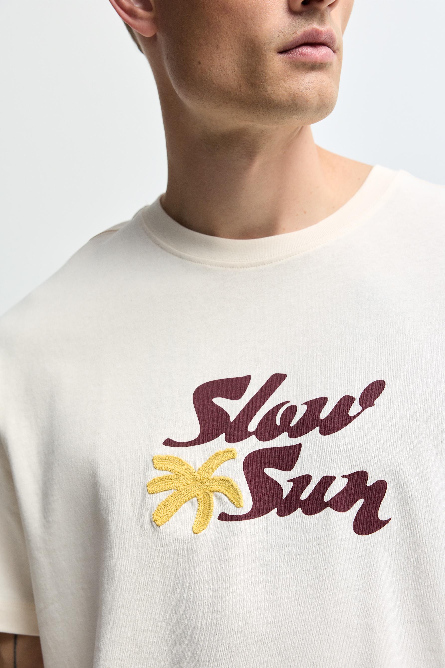 Embroidered text T-shirt — BUTTER