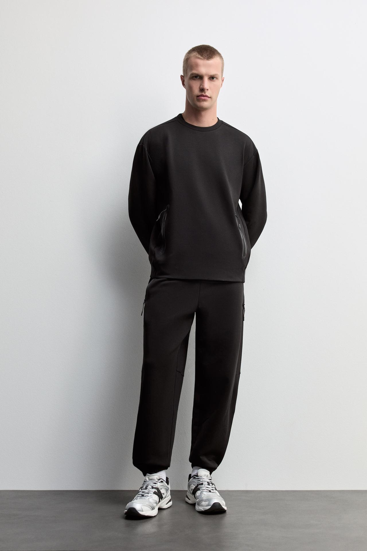 Wide-leg interlock trousers — BLACK