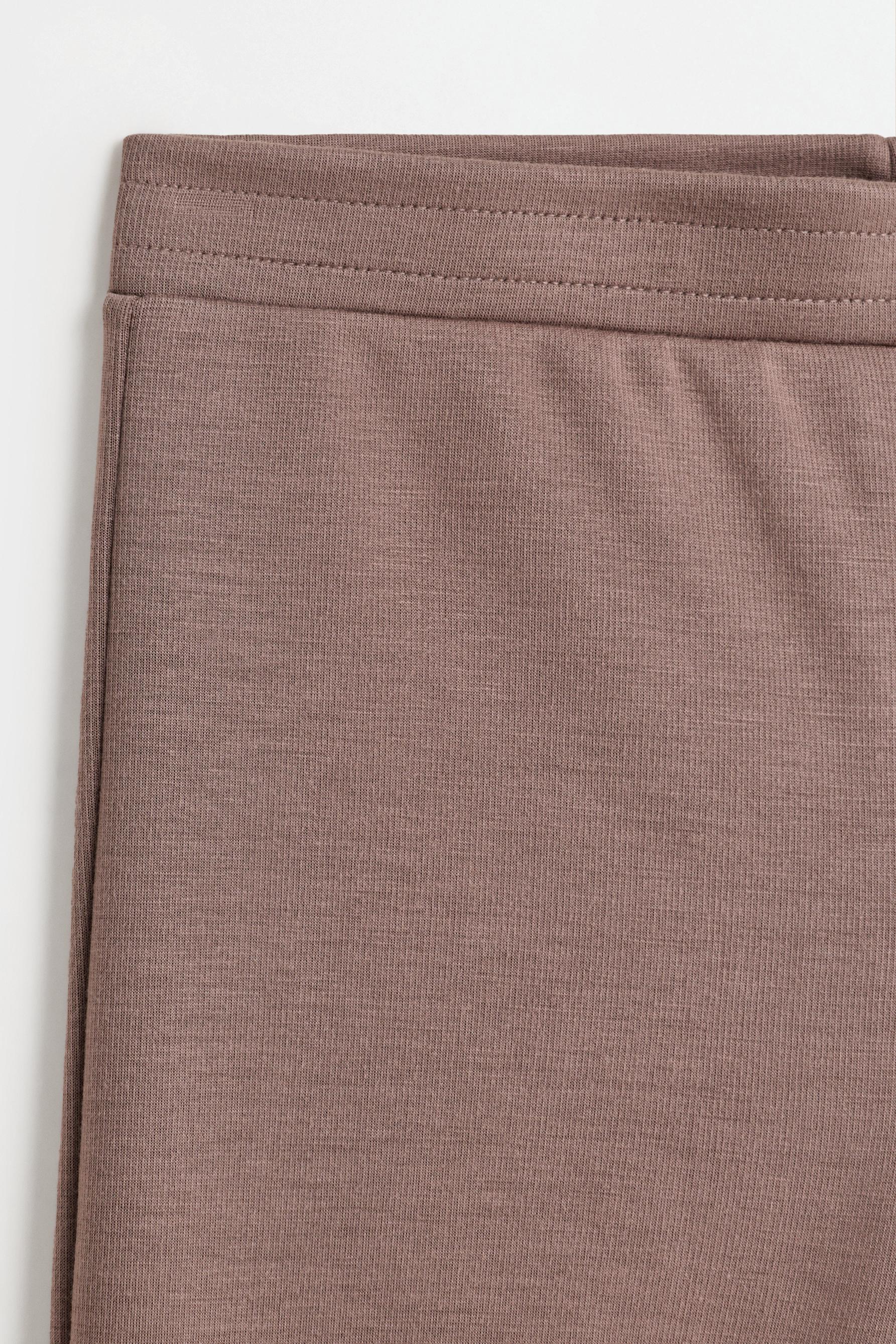 Bell bottom trousers with splits — MINK