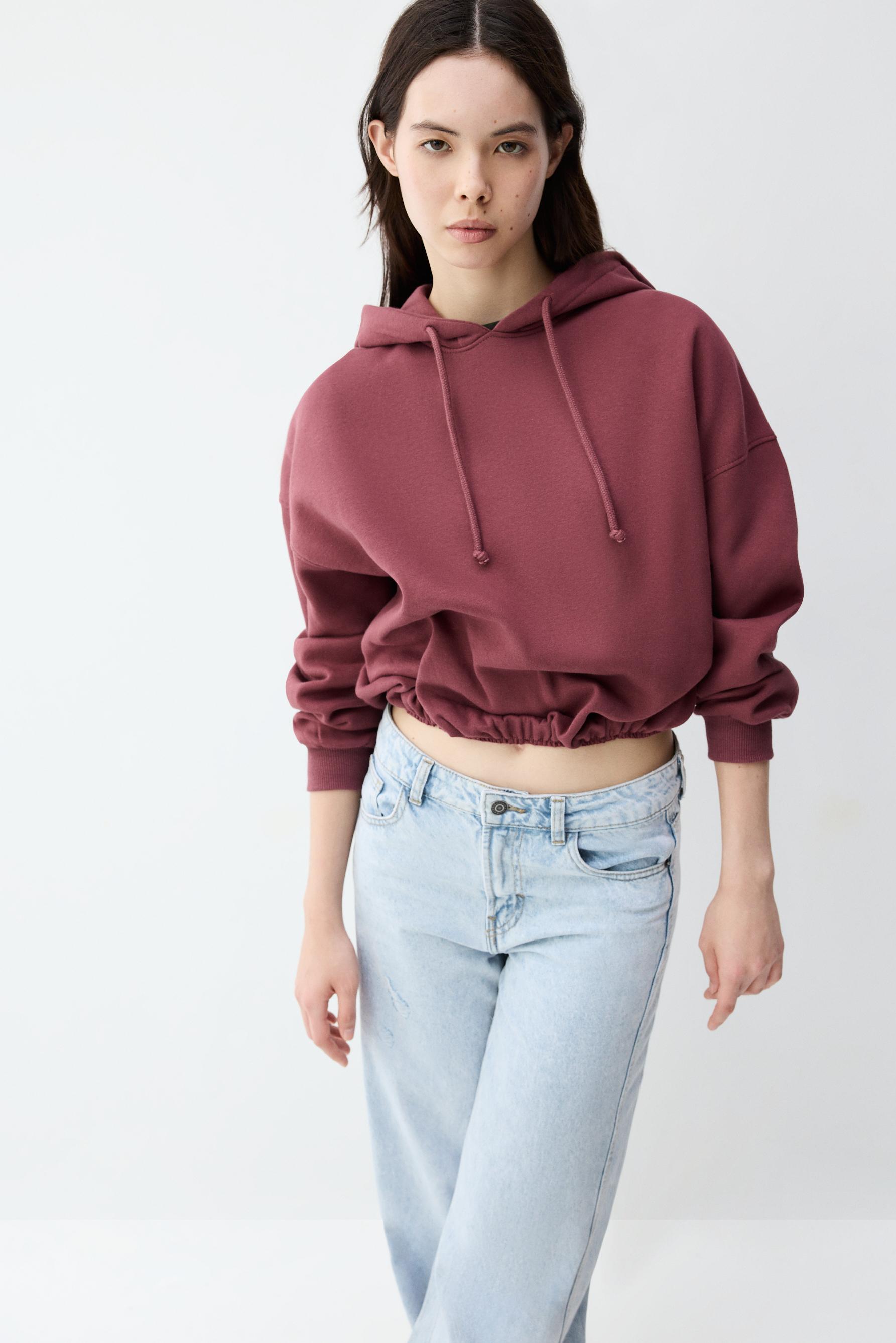 Sudadera cropped cuello capucha