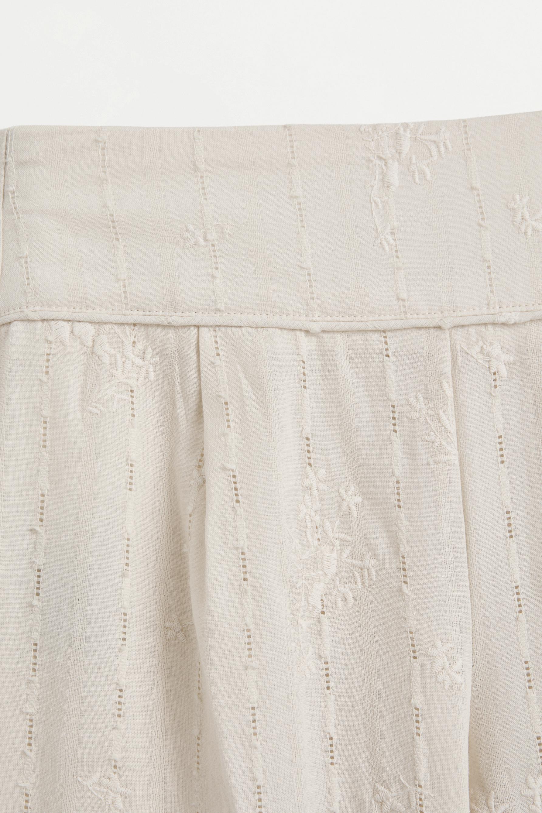 Embroidered trousers — SAND