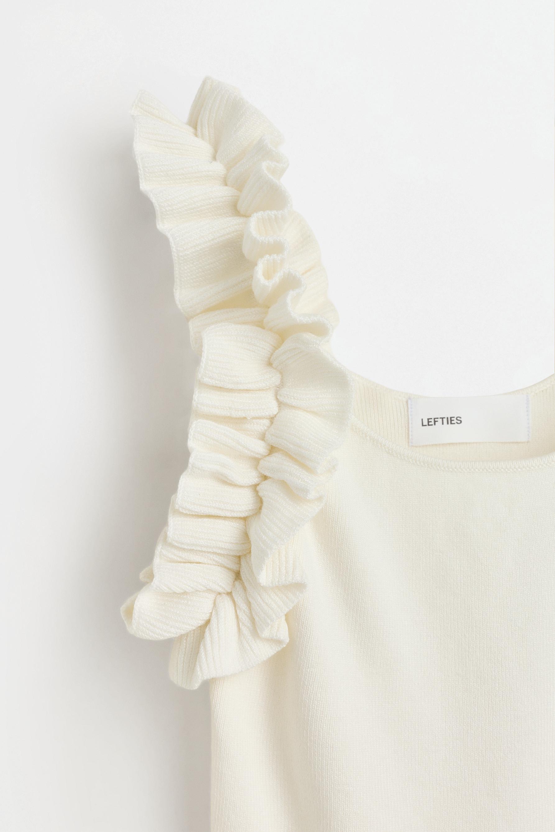 Ruffled knit top — WHITE