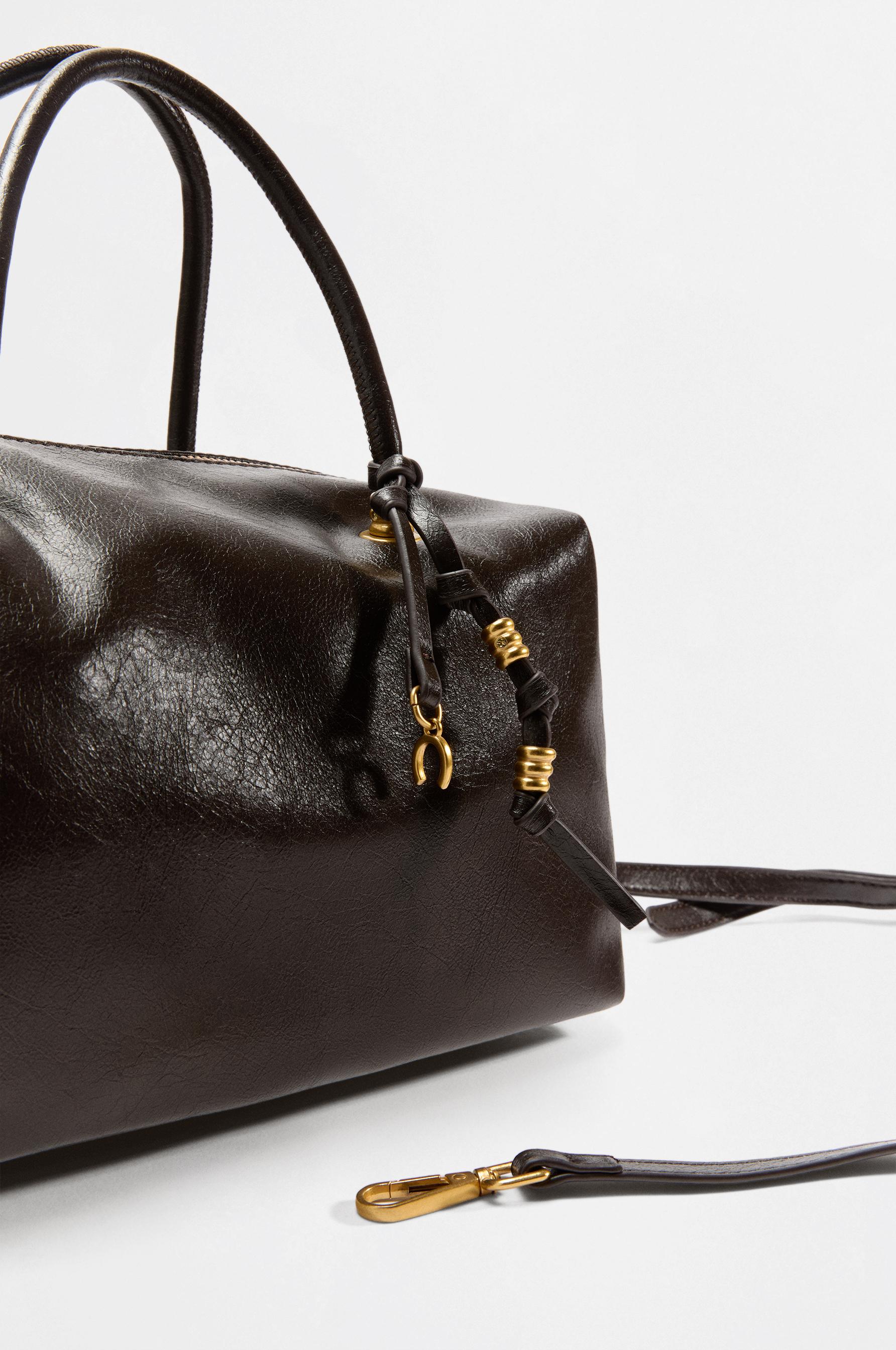 Bowling bag with charm — BROWN
