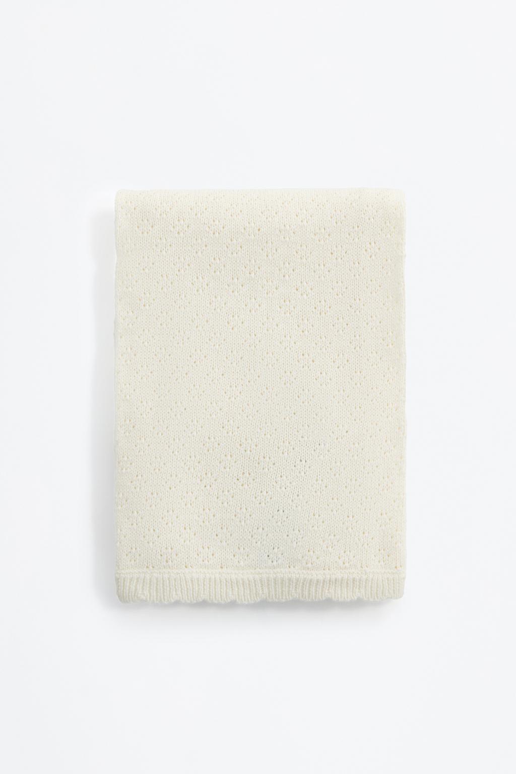 Knitted swaddling blanket