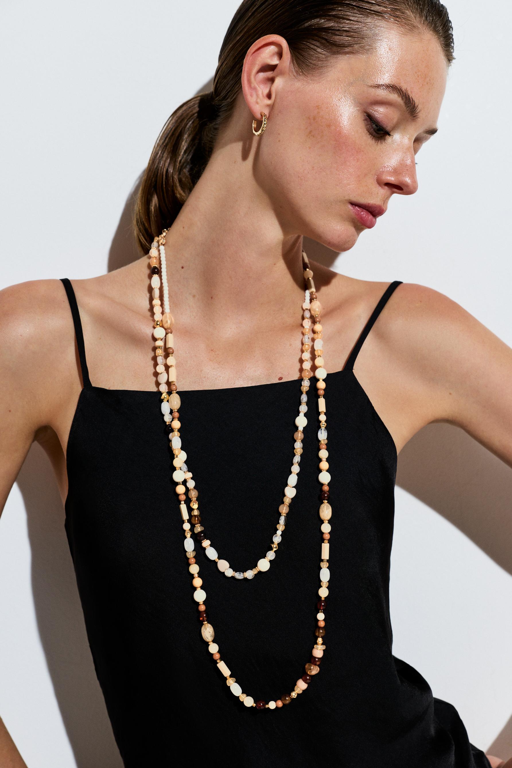 Double-strand long beaded necklace — VARIOUS