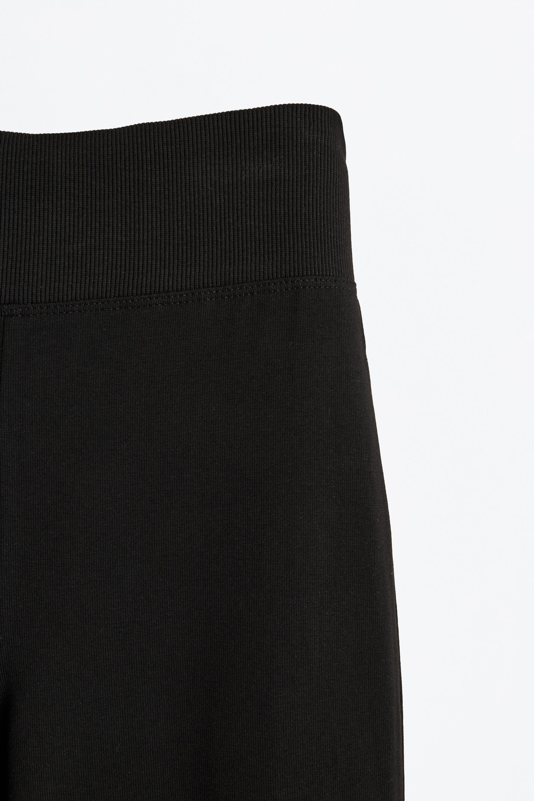 Bell bottom leggings with ribbed waist — BLACK
