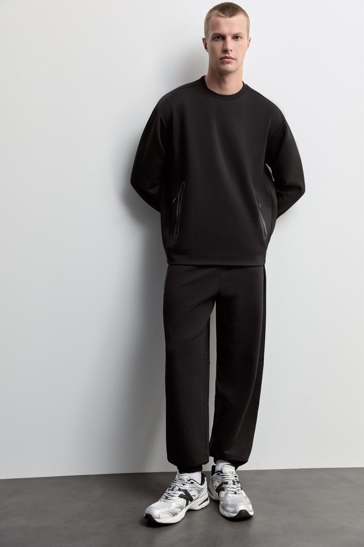 Wide-leg interlock trousers — BLACK