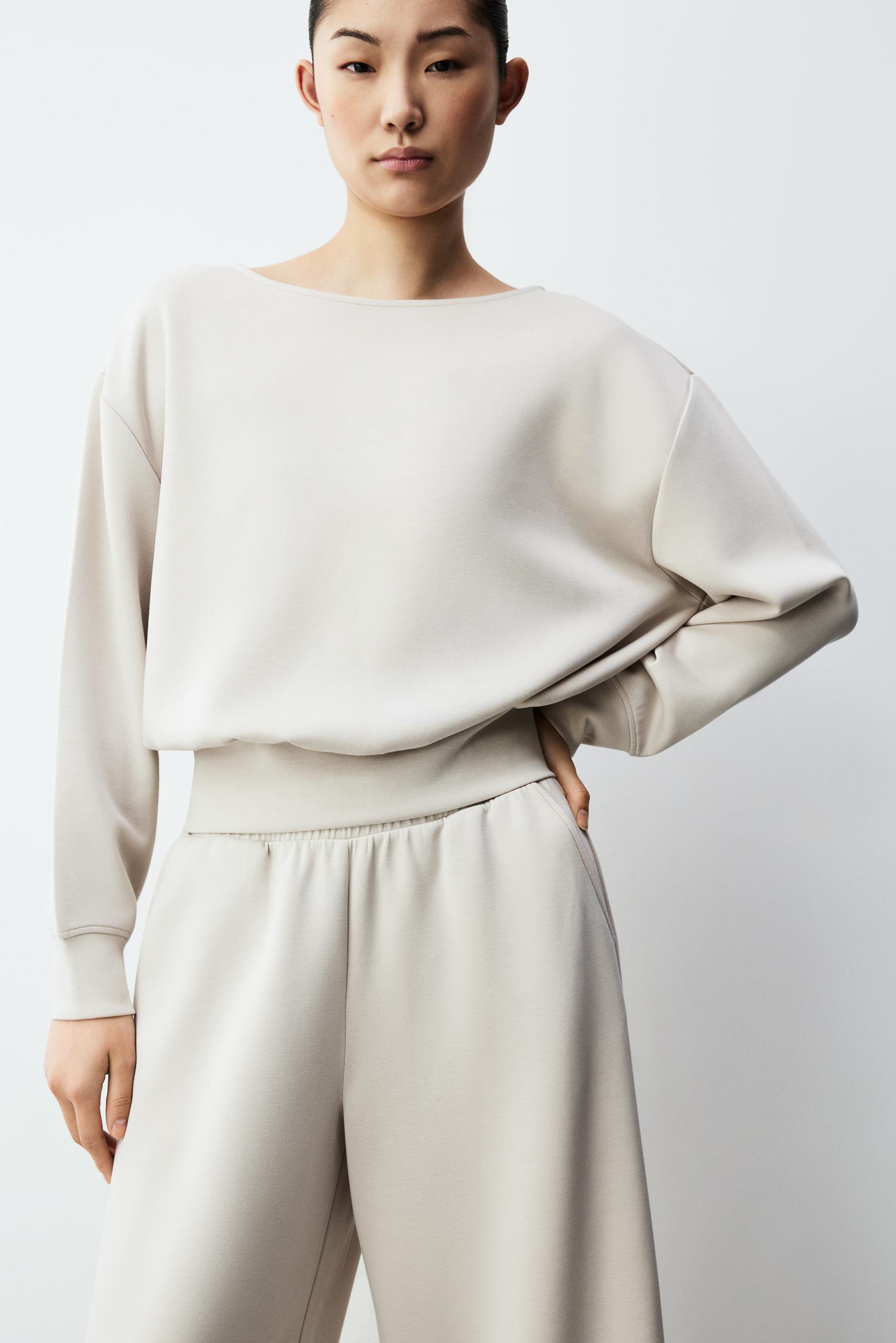 Sudadera fluida cuello barca