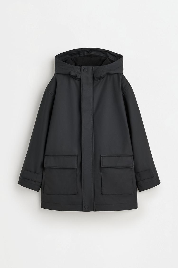 Long rubberised parka — BLACK