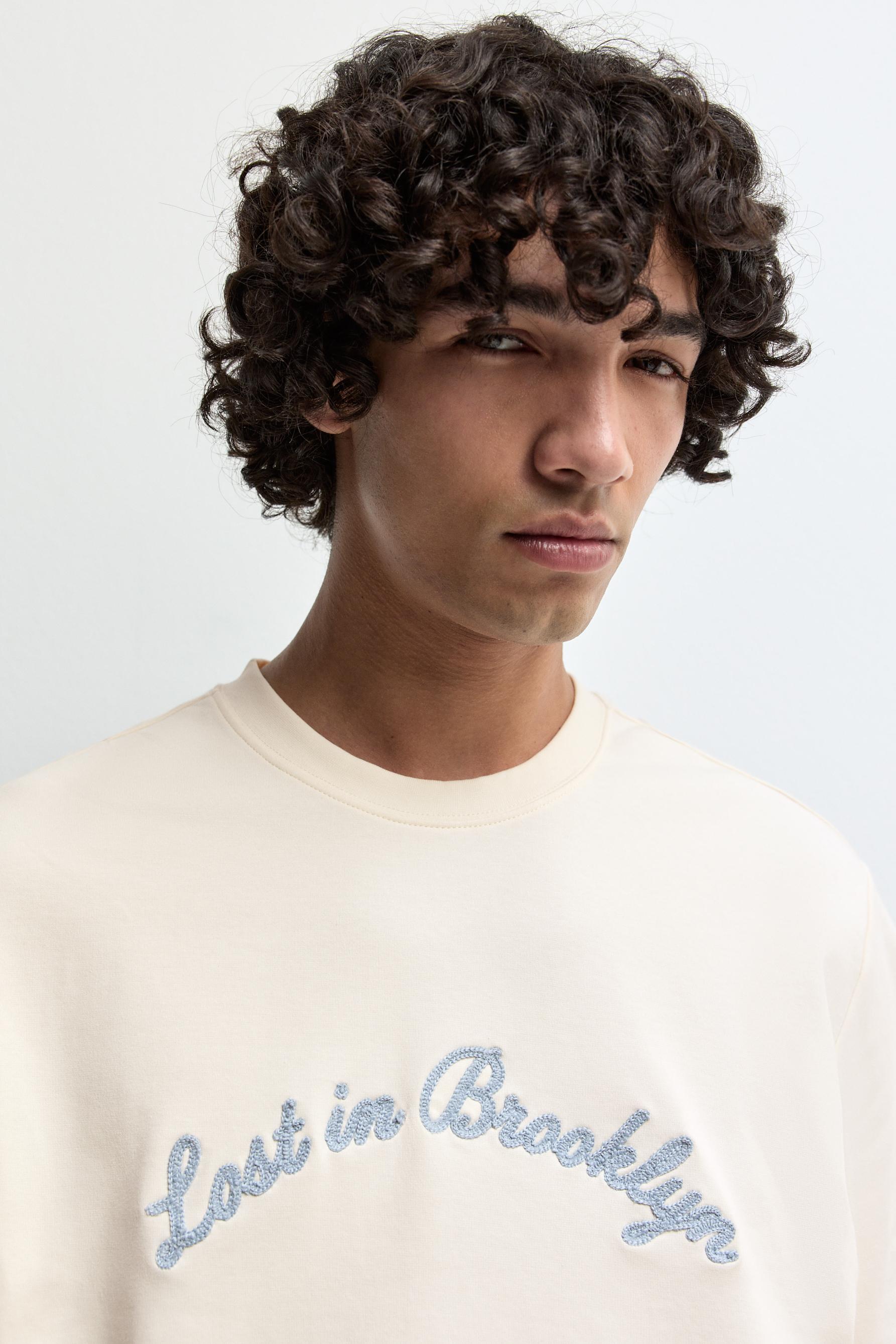 Embroidered interlock T-shirt — BUTTER