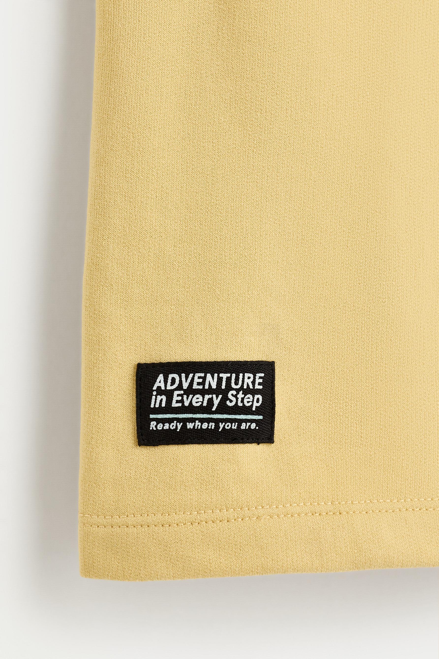 Text print plush Bermuda shorts — MUSTARD