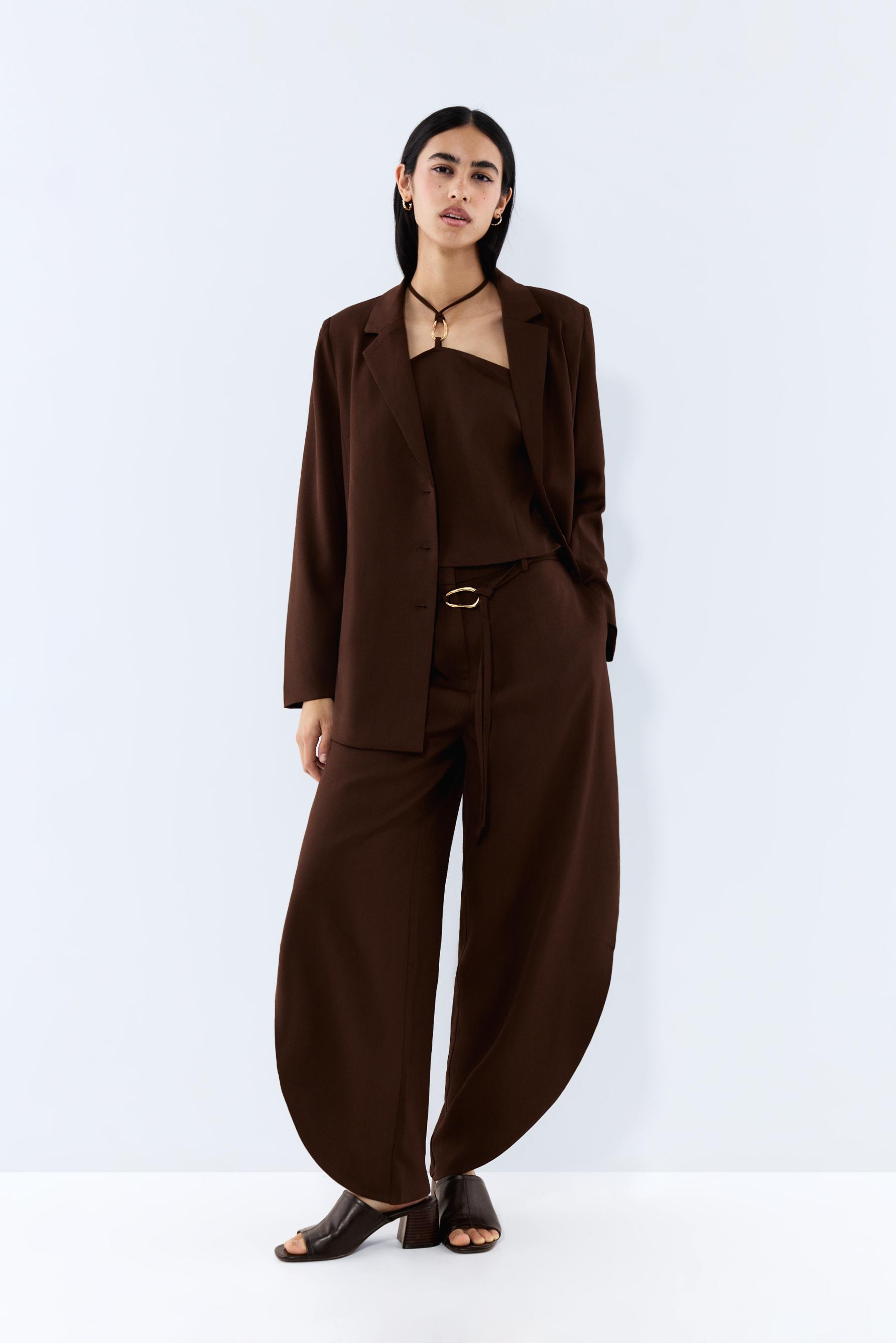 Pantalón aberturas anilla dorada