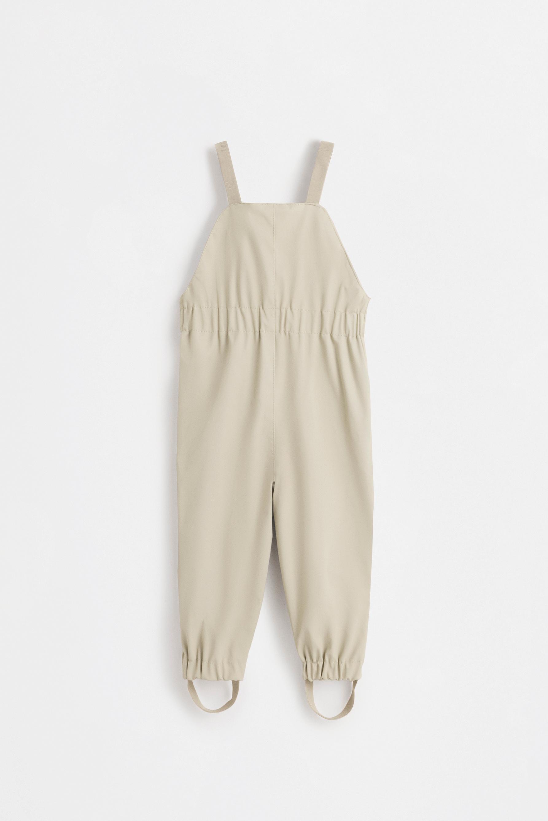 Rubberised fleece-lined dungarees — BEIGE
