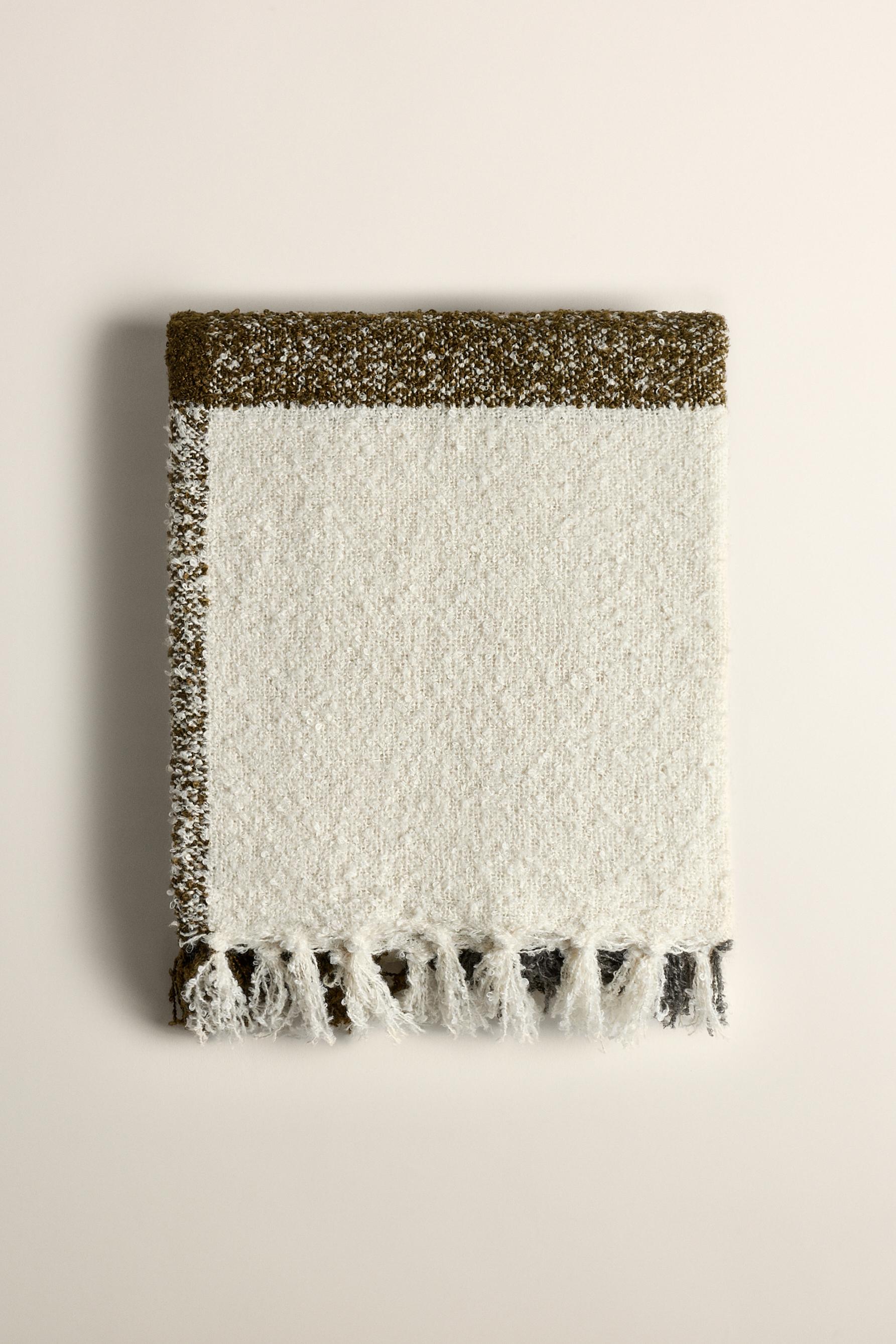 Manta bouclé cuadros con flecos 140 x 190 cm