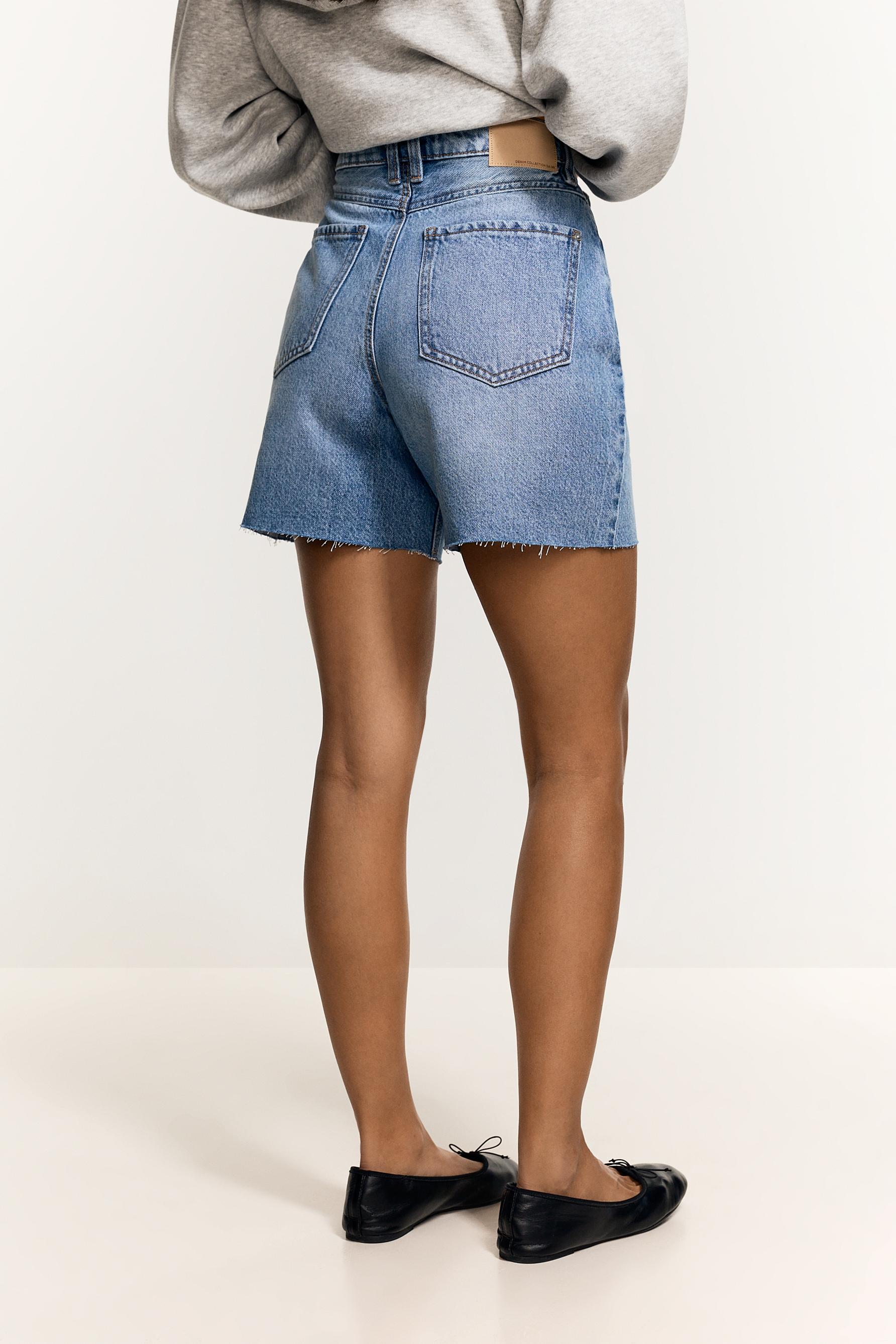 Distressed denim Bermuda shorts — PALE INDIGO