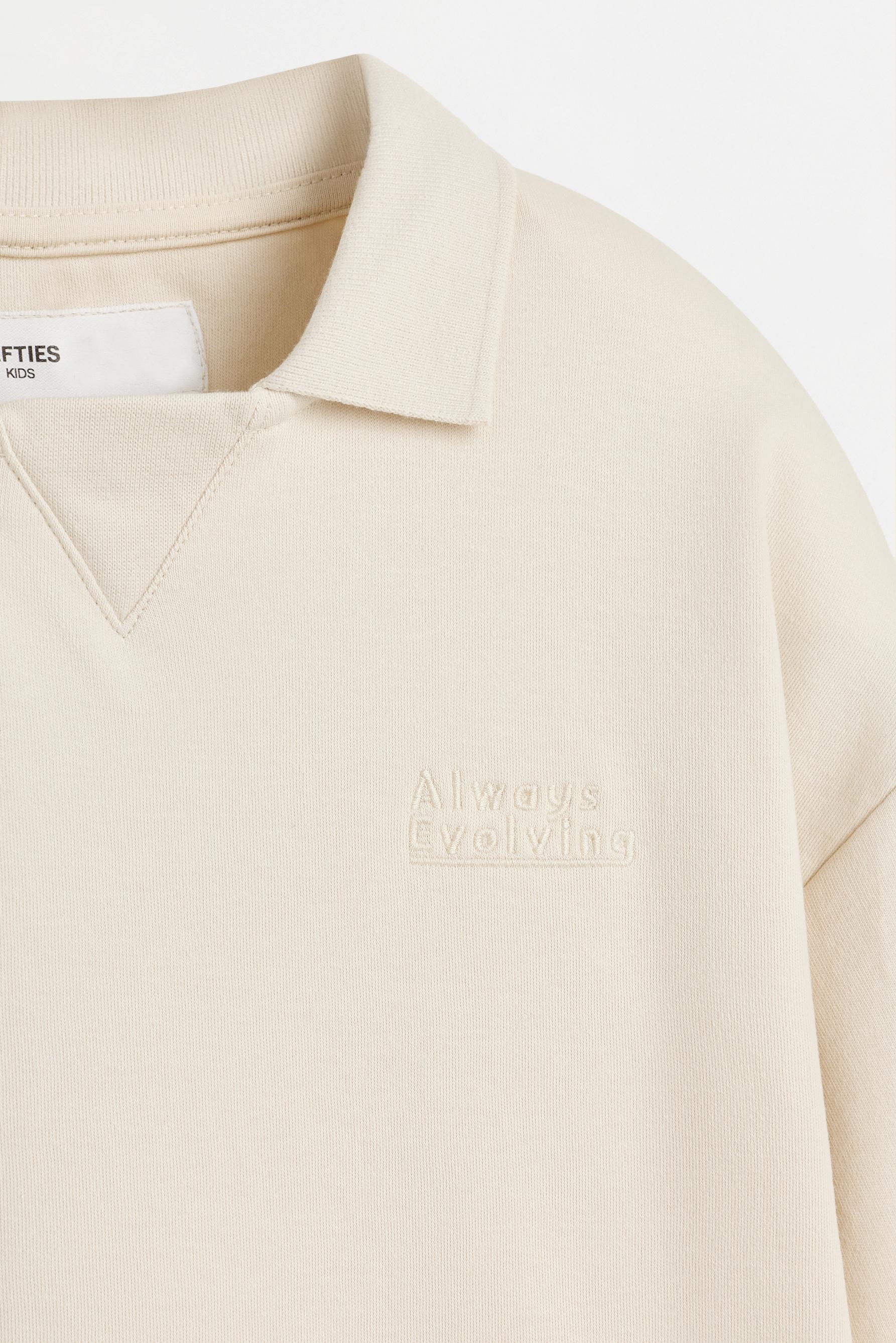 Interlock polo shirt with text — ECRU